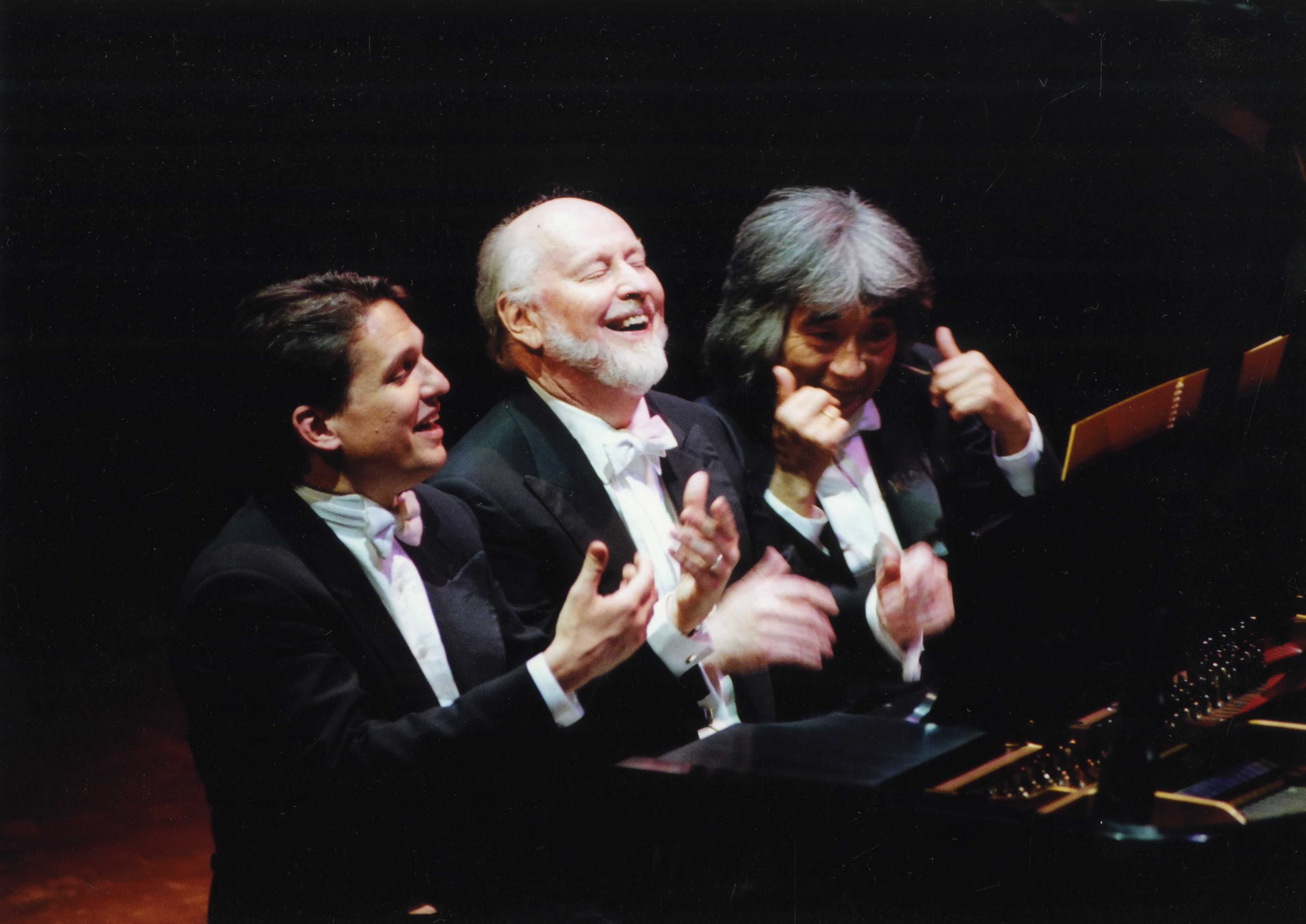 Keith Lockhart, John Williams, and Seiji Ozawa play the piano during the Symphony Hall Centennial