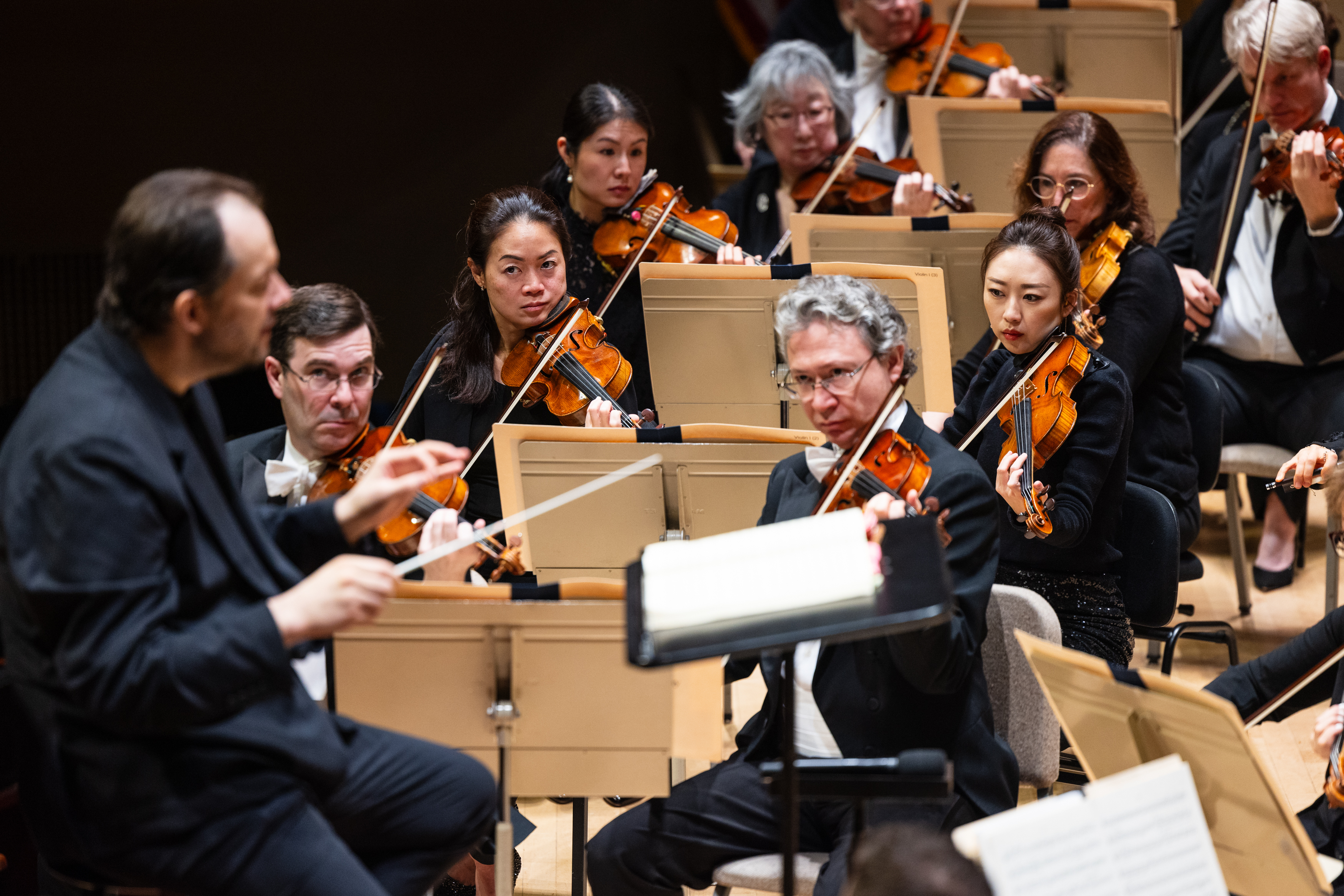 Andris conducting the BSO seated