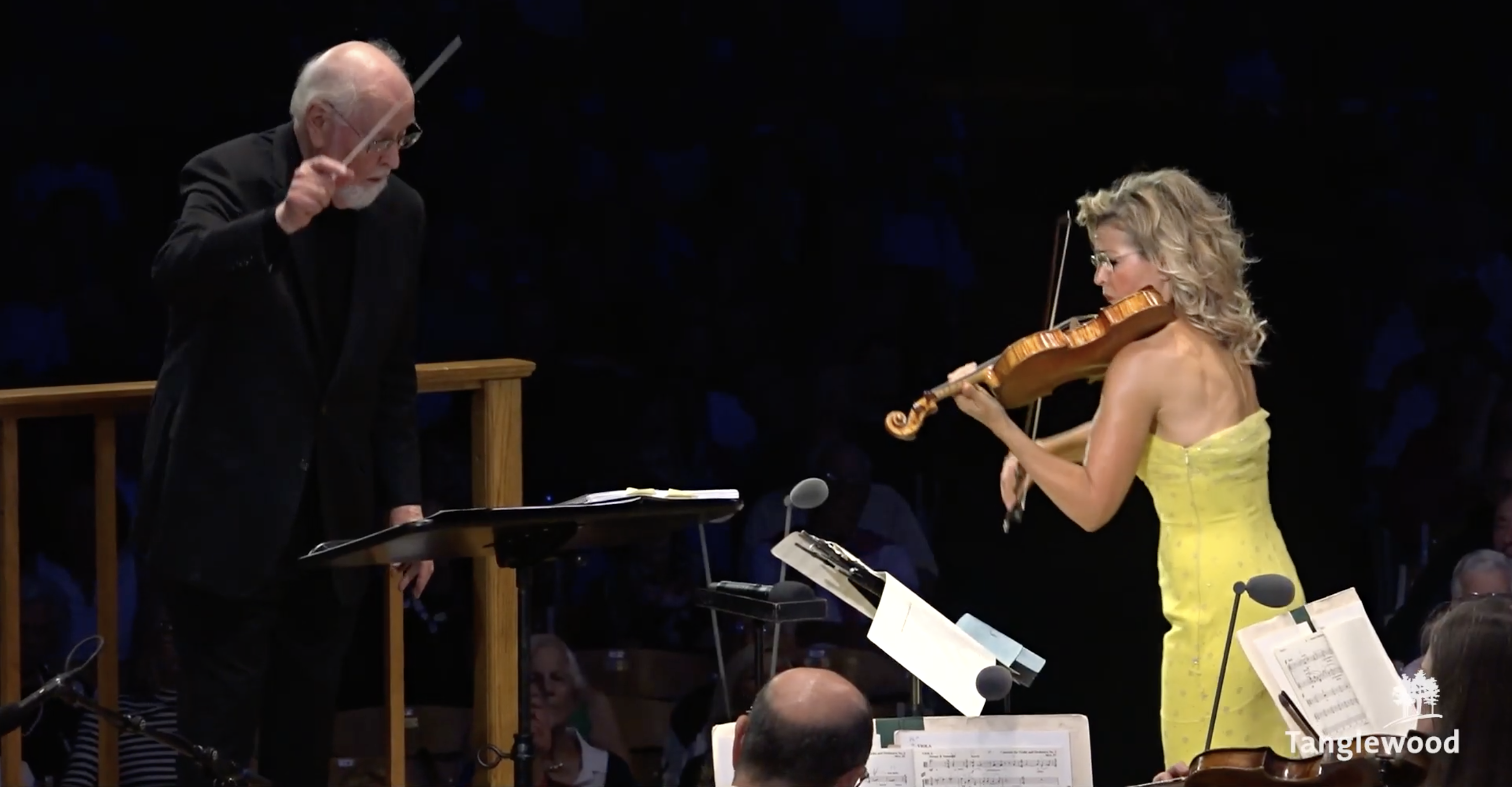 John Williams (left) conducts Ann-Sophie Mutter during the premiere of John Williams' new song at Tanglewood.