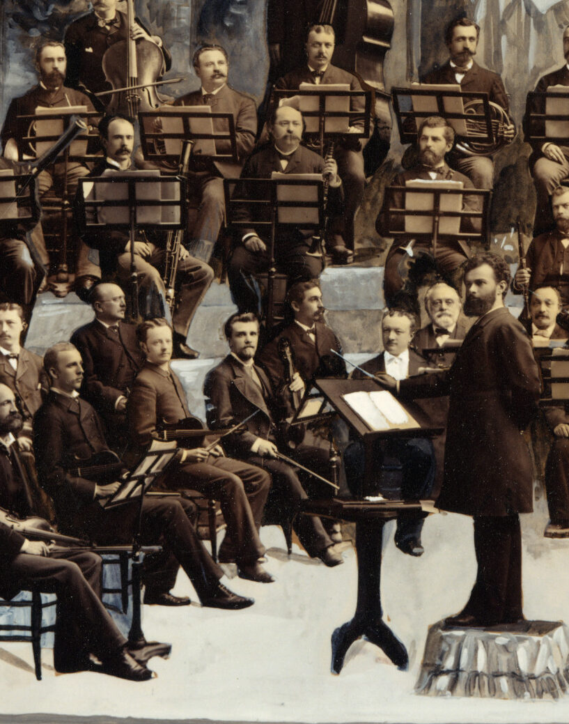 Photographic collage cropped to detail of four men seated near the back of the orchestra with French horns