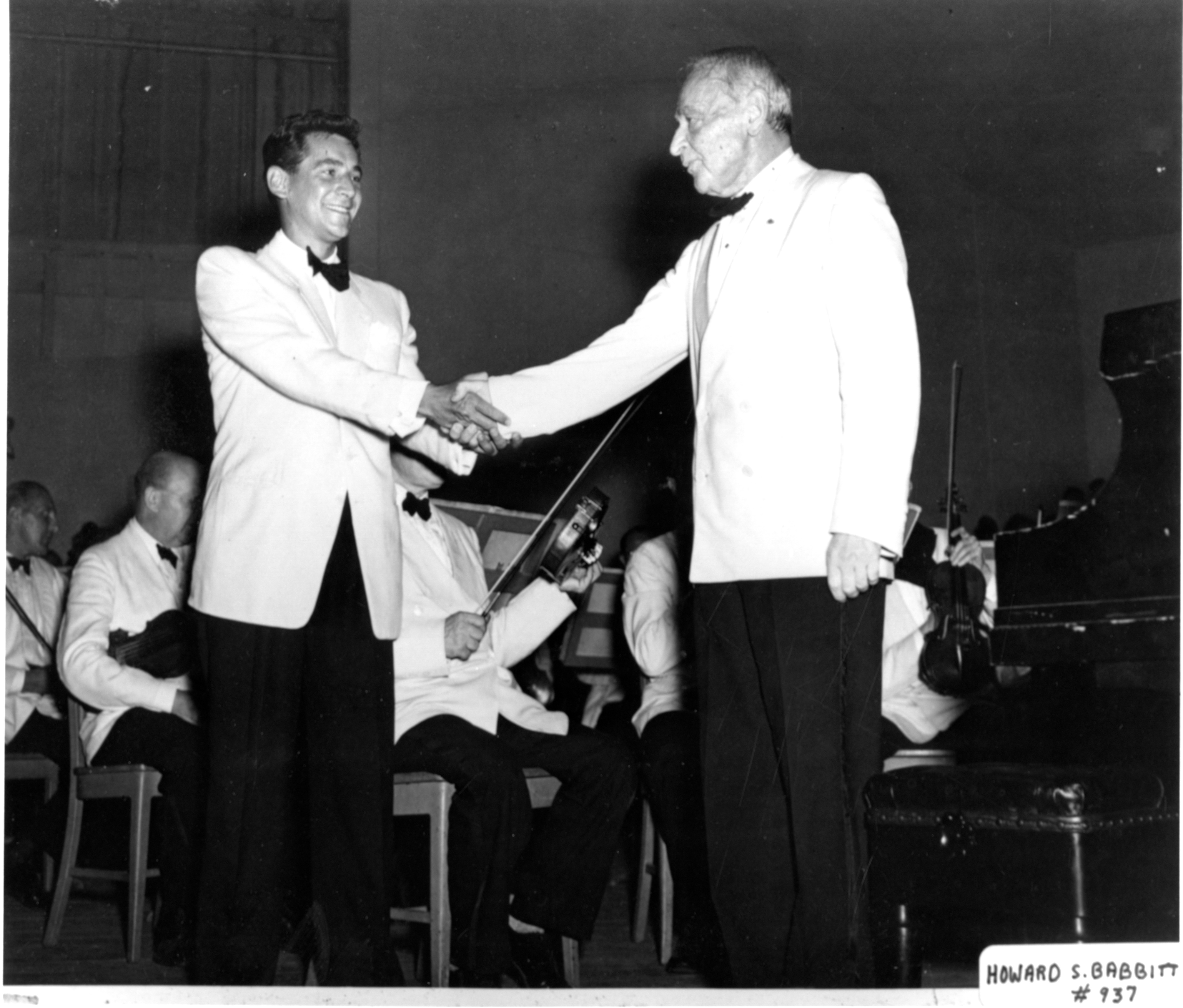 Leonard Bernstein shakes hands with Serge Koussevitzky after a performance of at Tanglewood