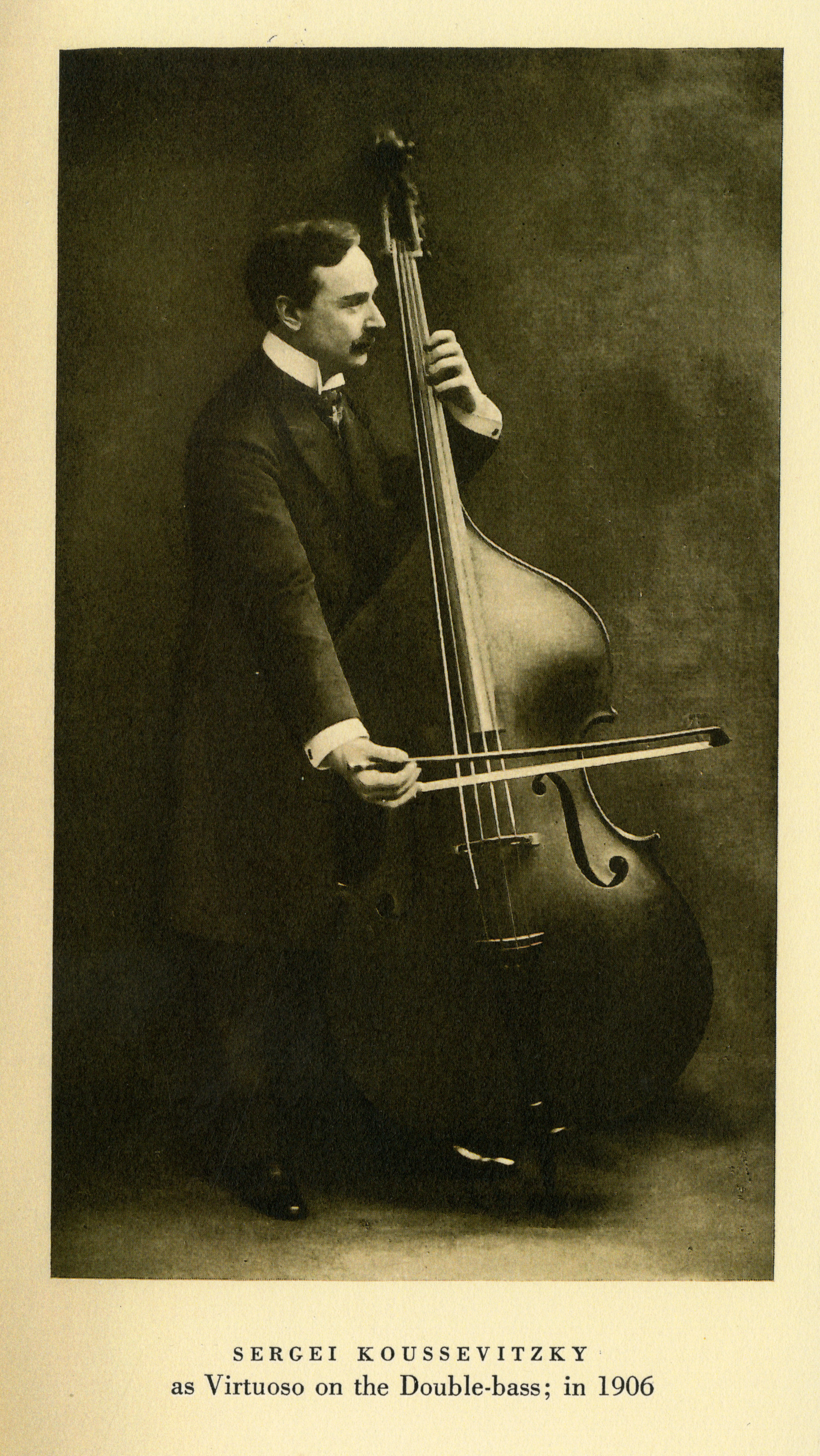 A young Serge Koussevitzky, with dark hair and a moustache, plays the double bass