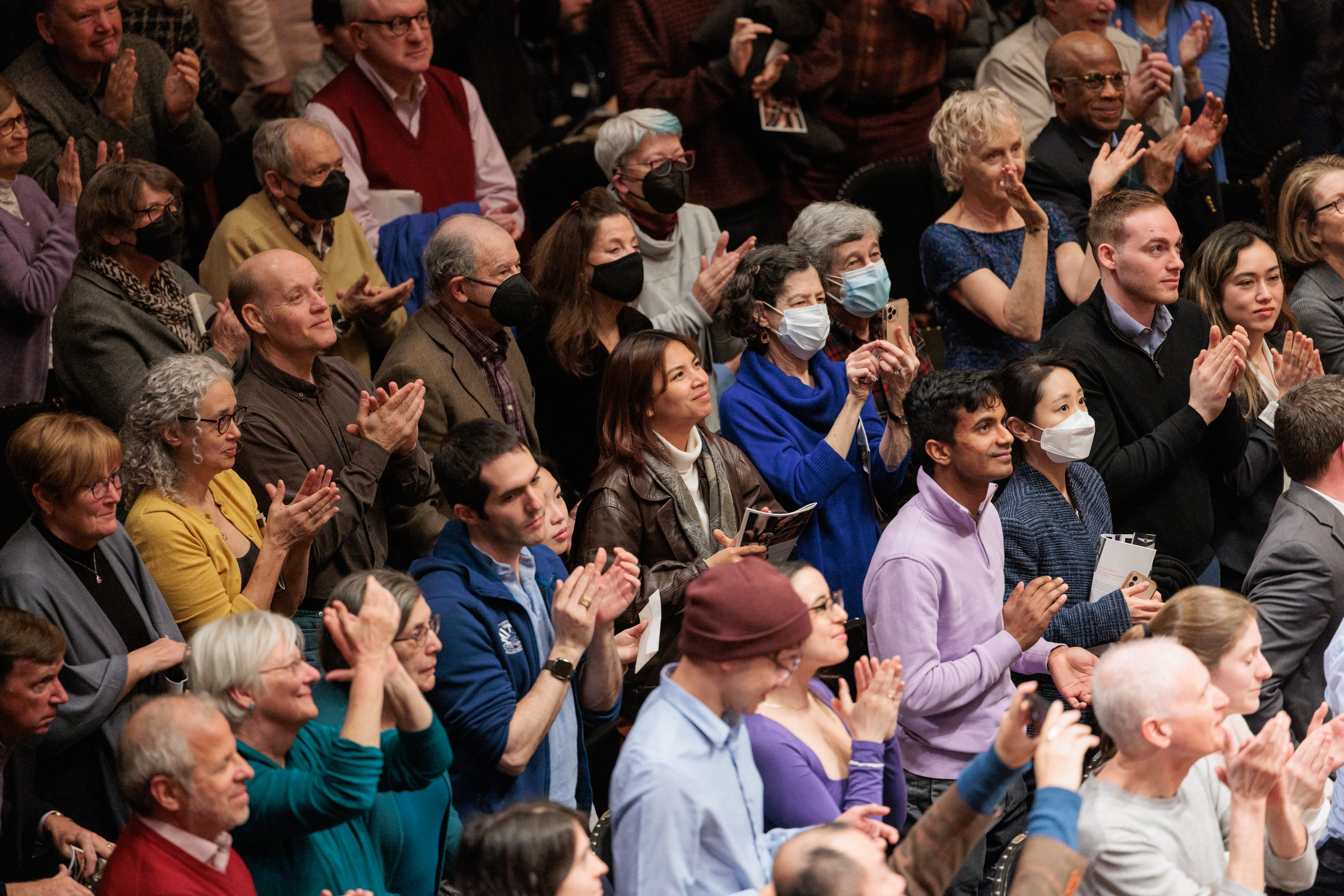 A crowd is giving a standing ovation