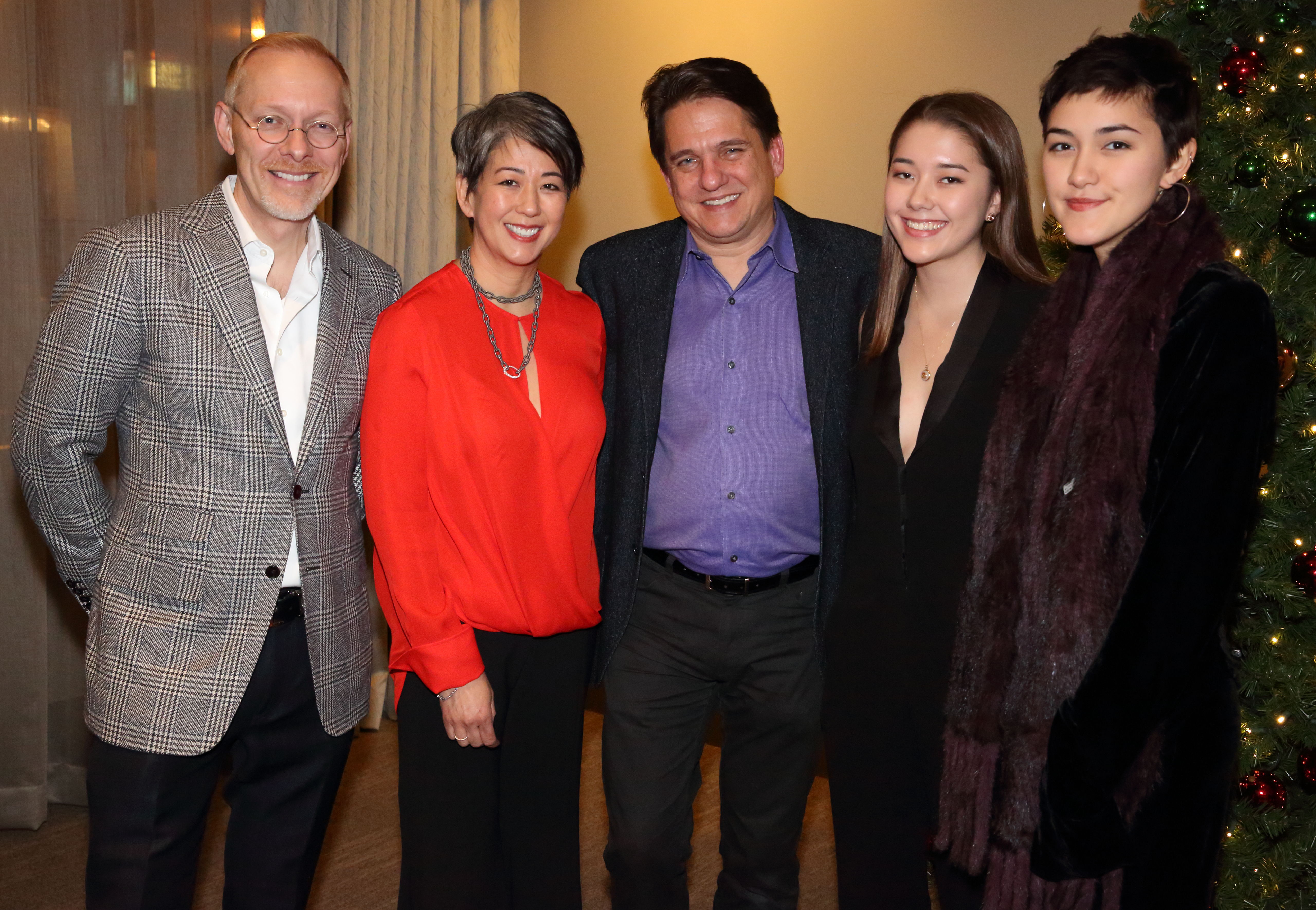 Keith Lockhart with four donors at a holiday pops meet and greet.