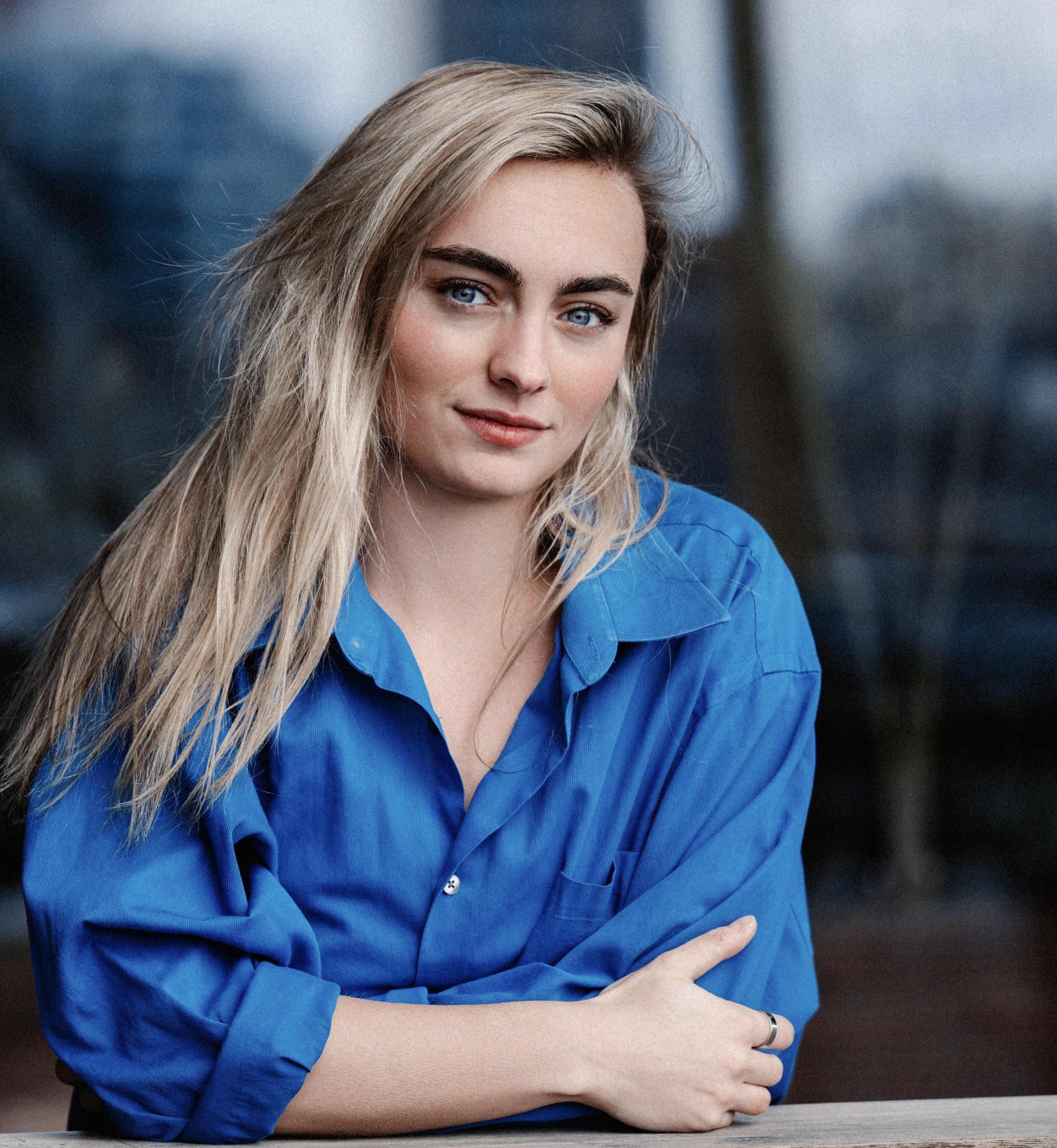 Elise Arancio headshot wearing a blue shirt.