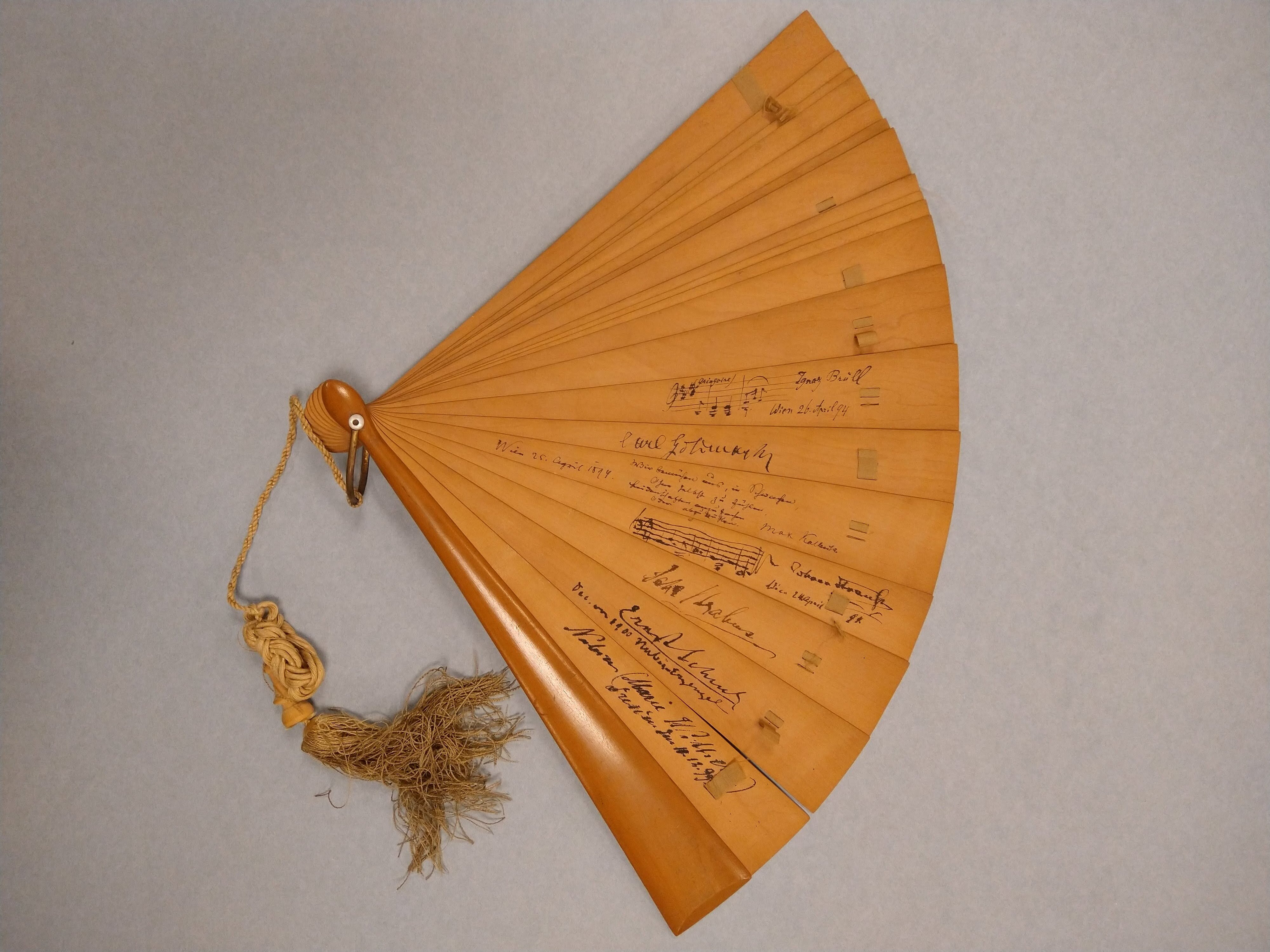 Sandalwood fan with autographs and musical quotations inscribed on it