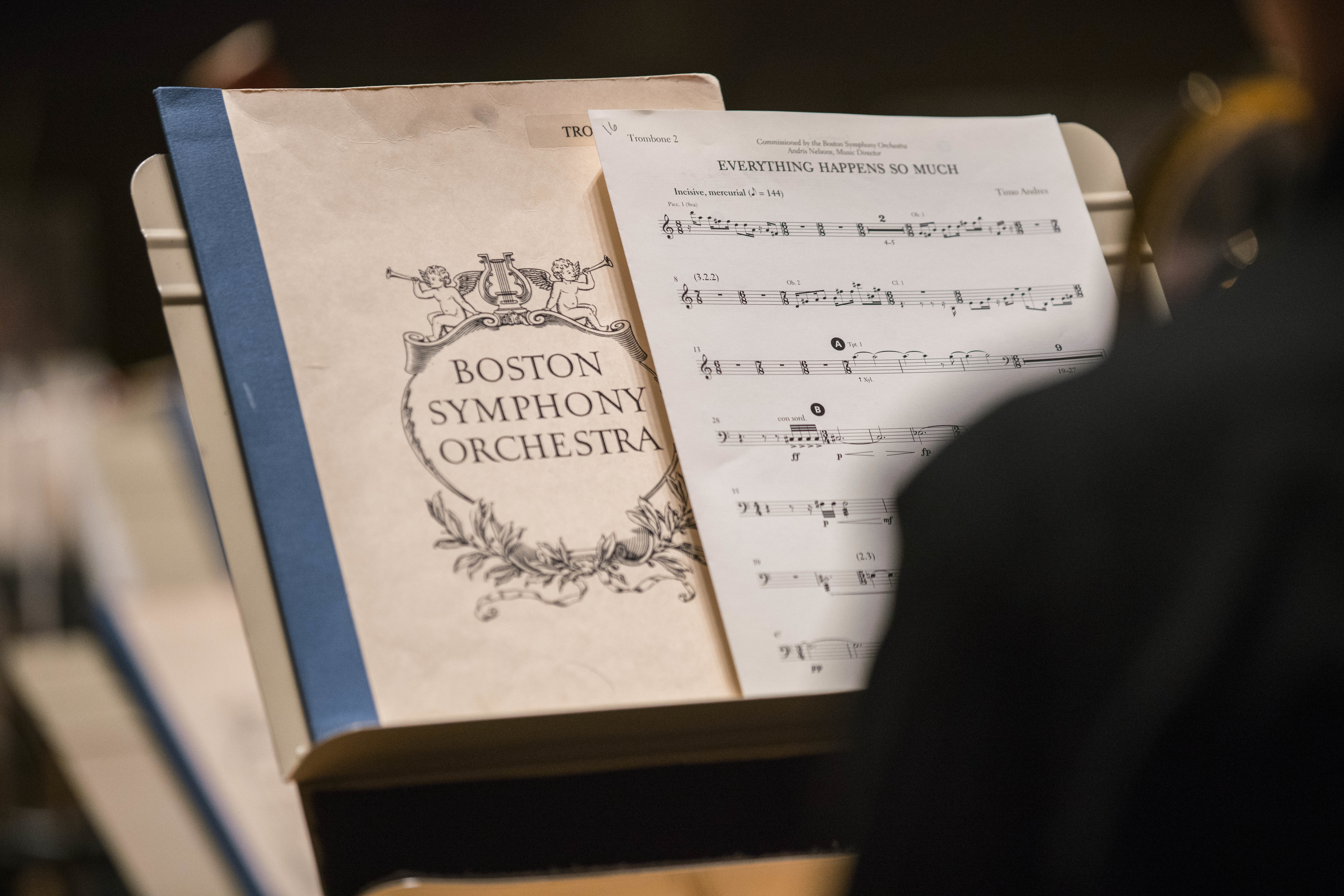 A piece of music and a folder reading "Boston Symphony Orchestra" sit on a music stand