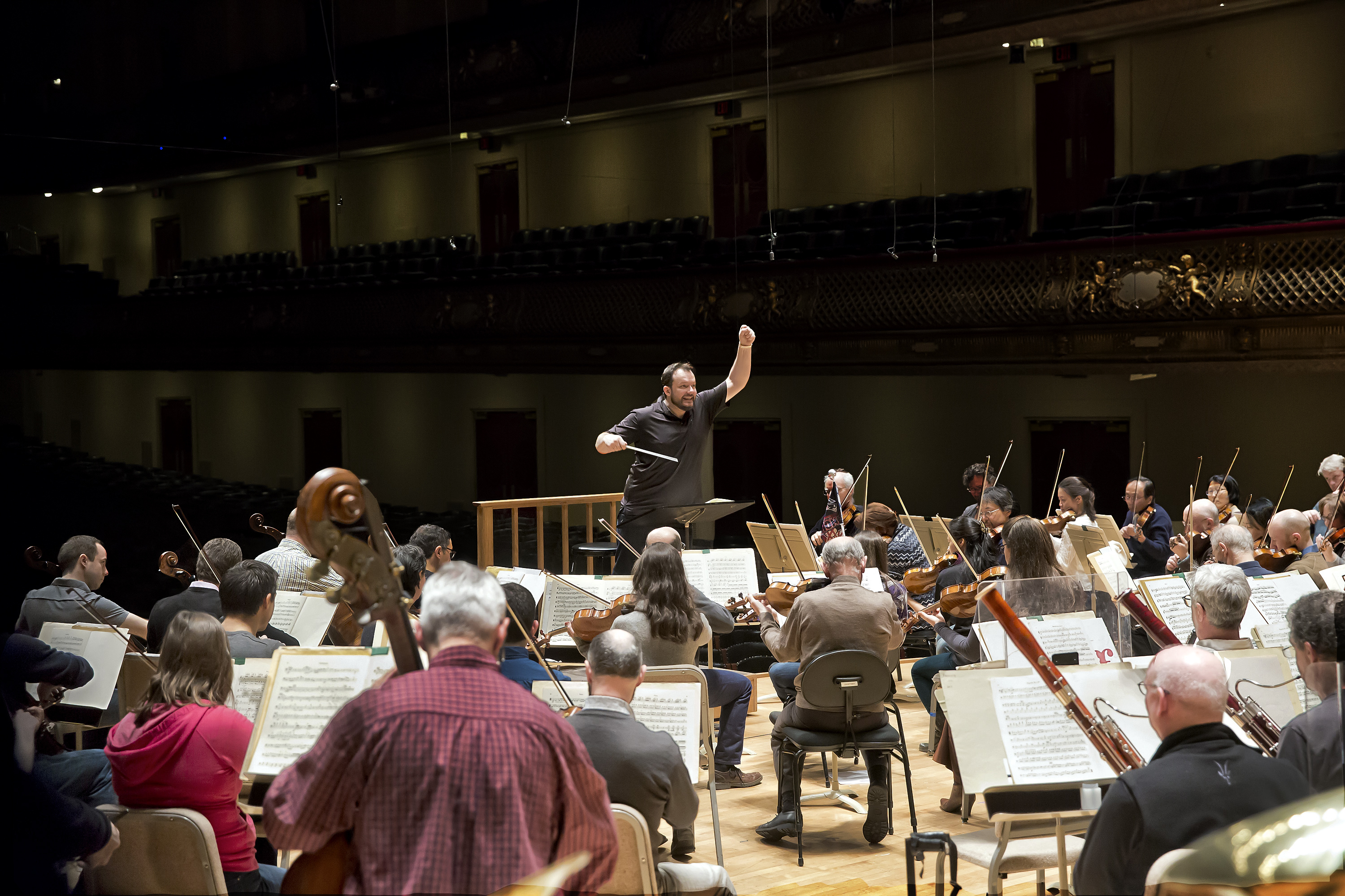 Andris Neslons conducting a rehearsal at Symphony Hall in Boston.