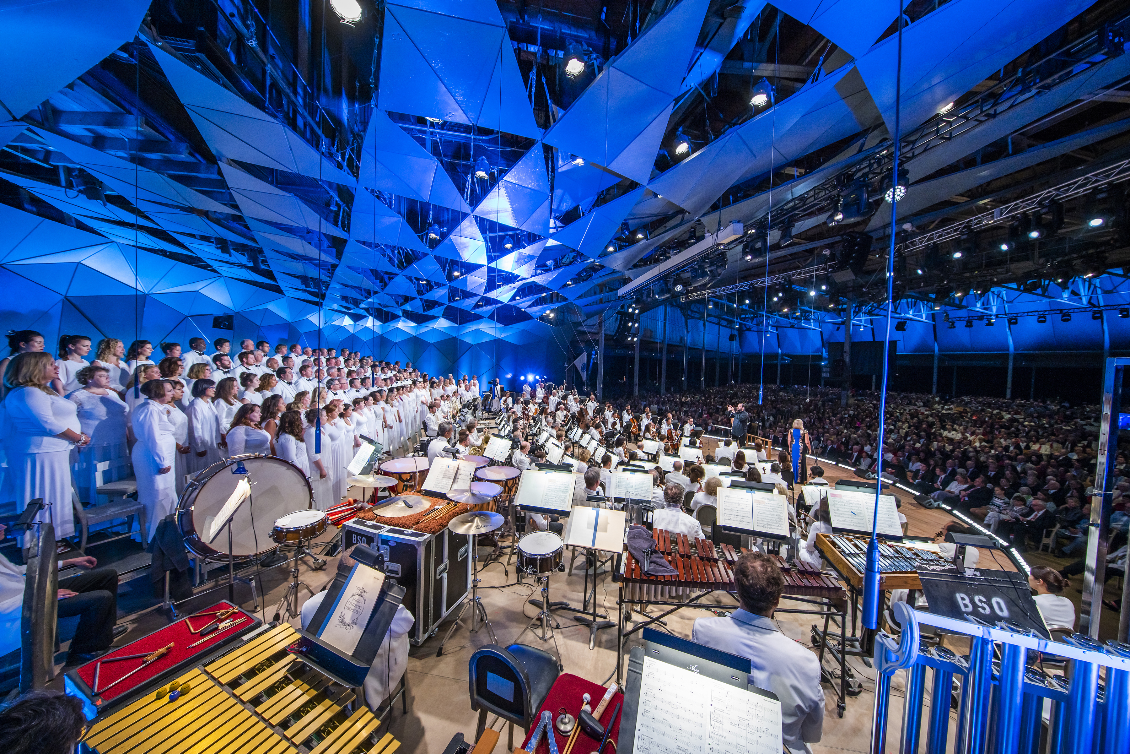 Andris Nelsons conducting the BSO onstage in the Koussevitzky Music Shed