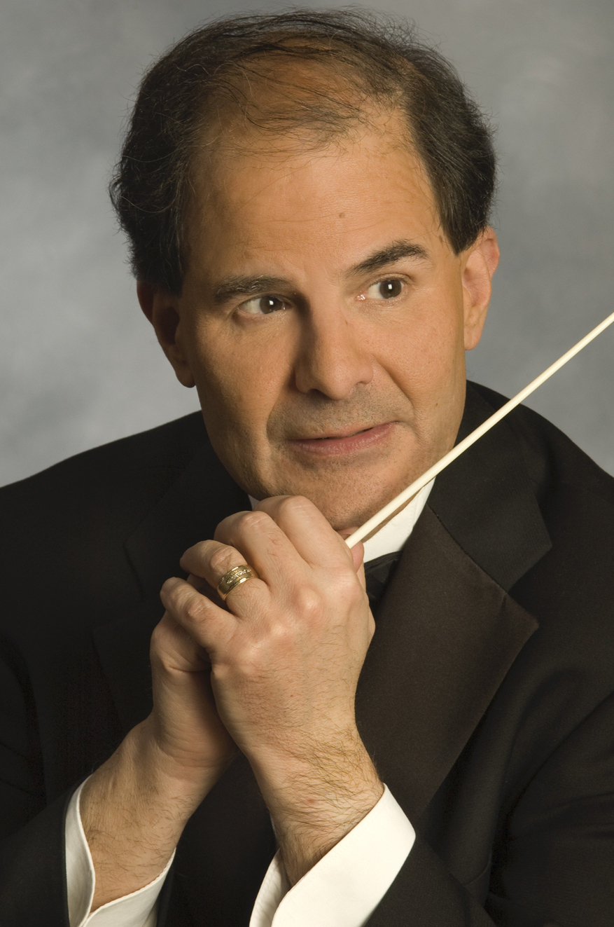 Headshot of David Martins wearing a tuxedo and holding his baton