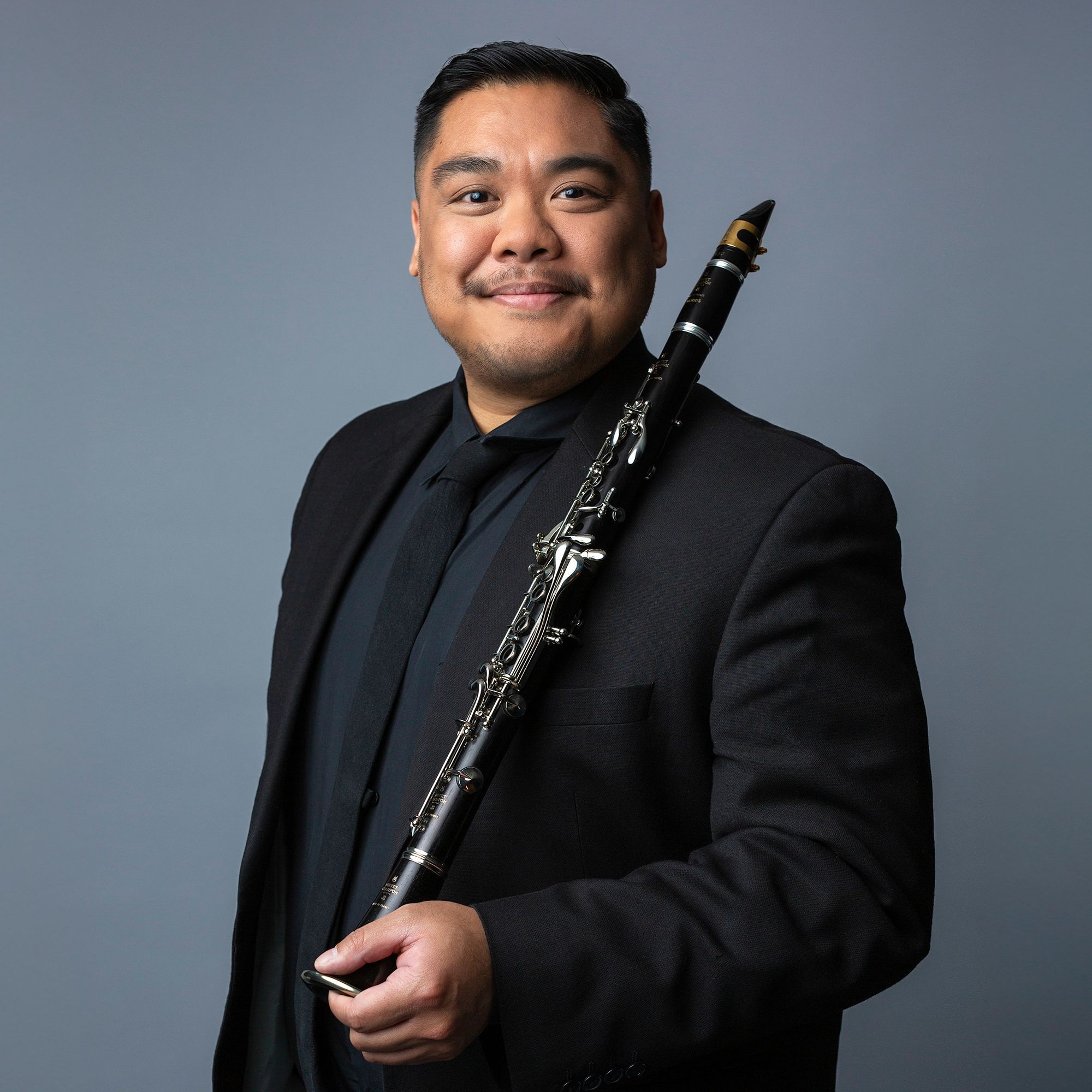 Christopher Elchico portrait holding clarinet