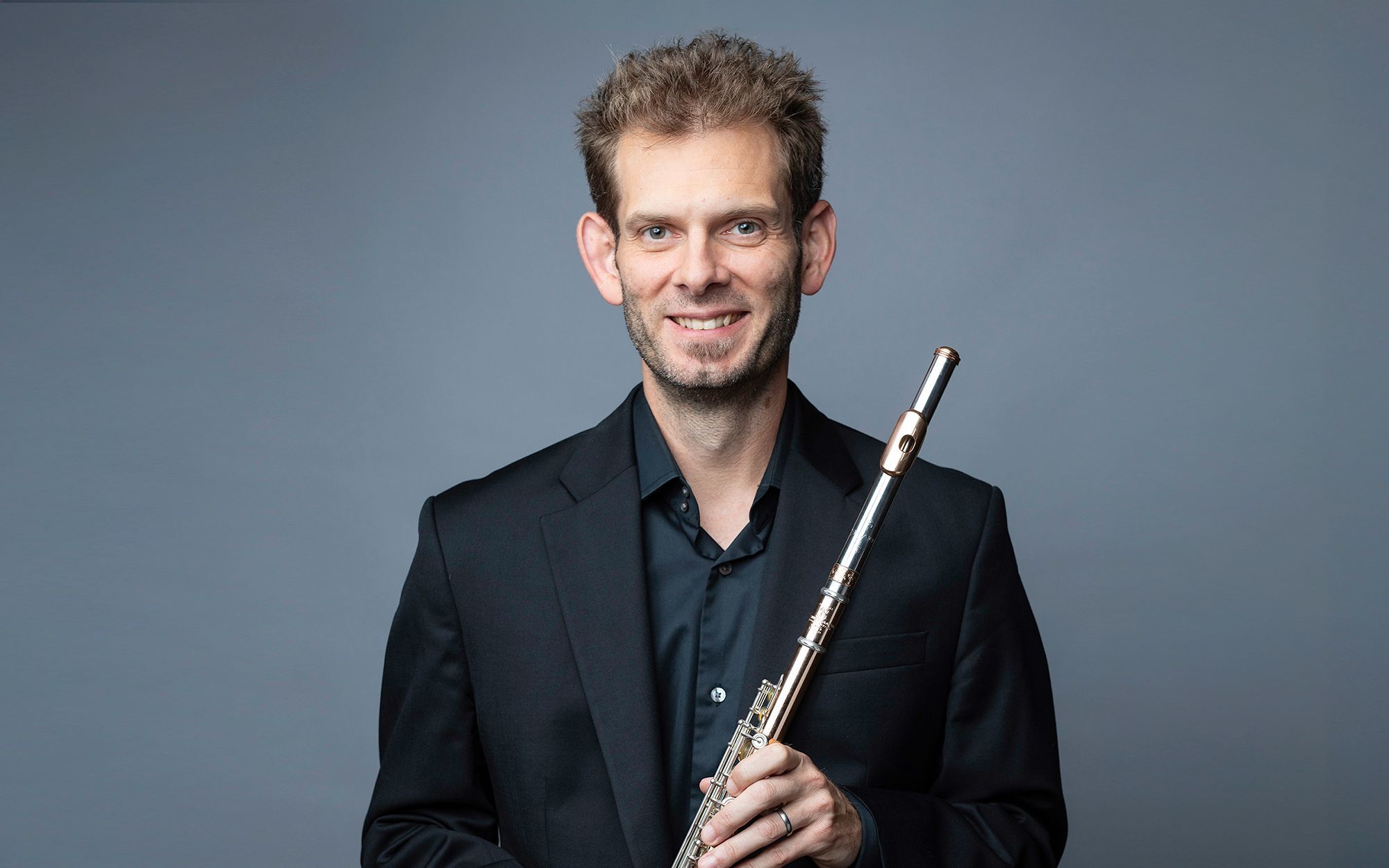 Clint Foreman headshot with flute