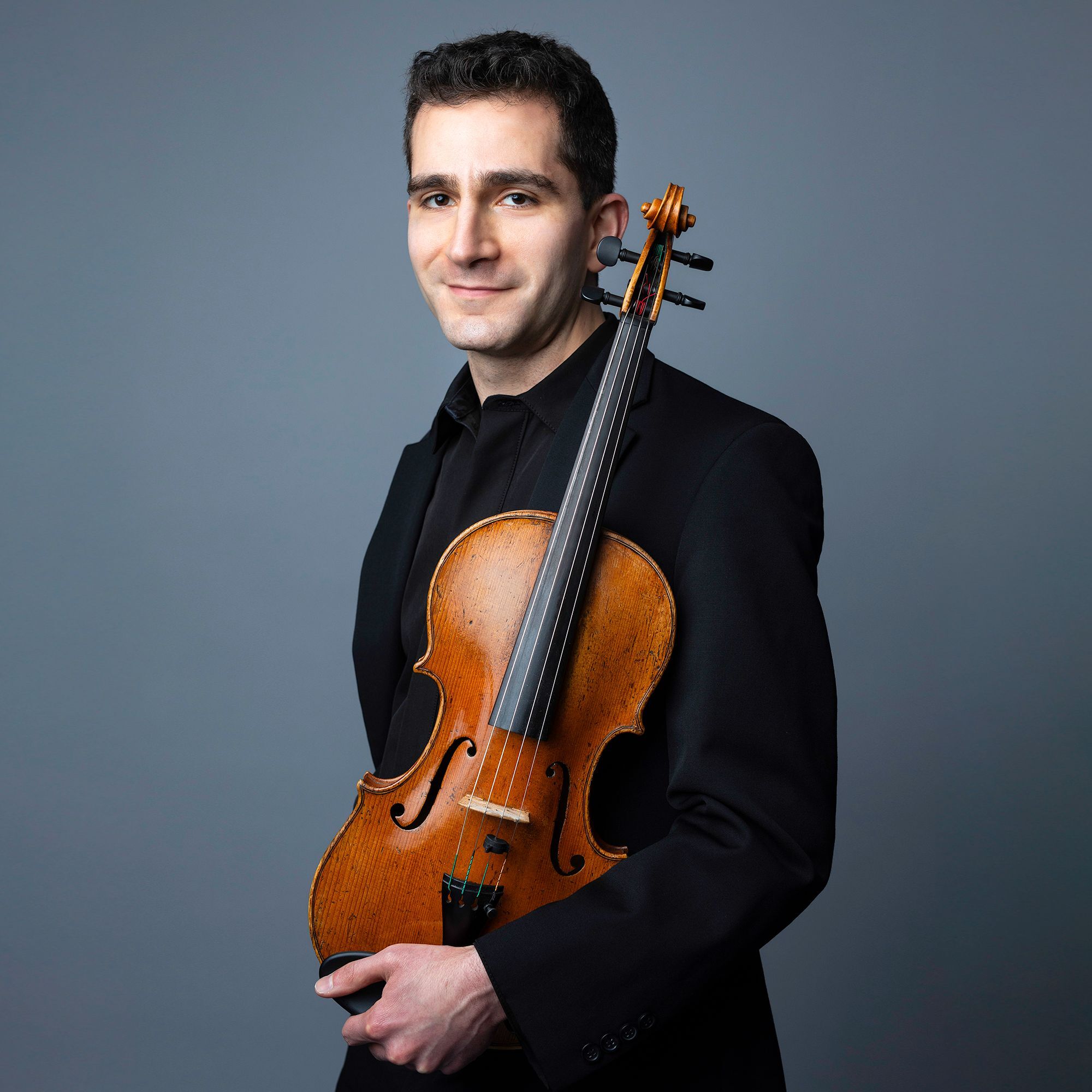 Daniel Getz headshot with viola