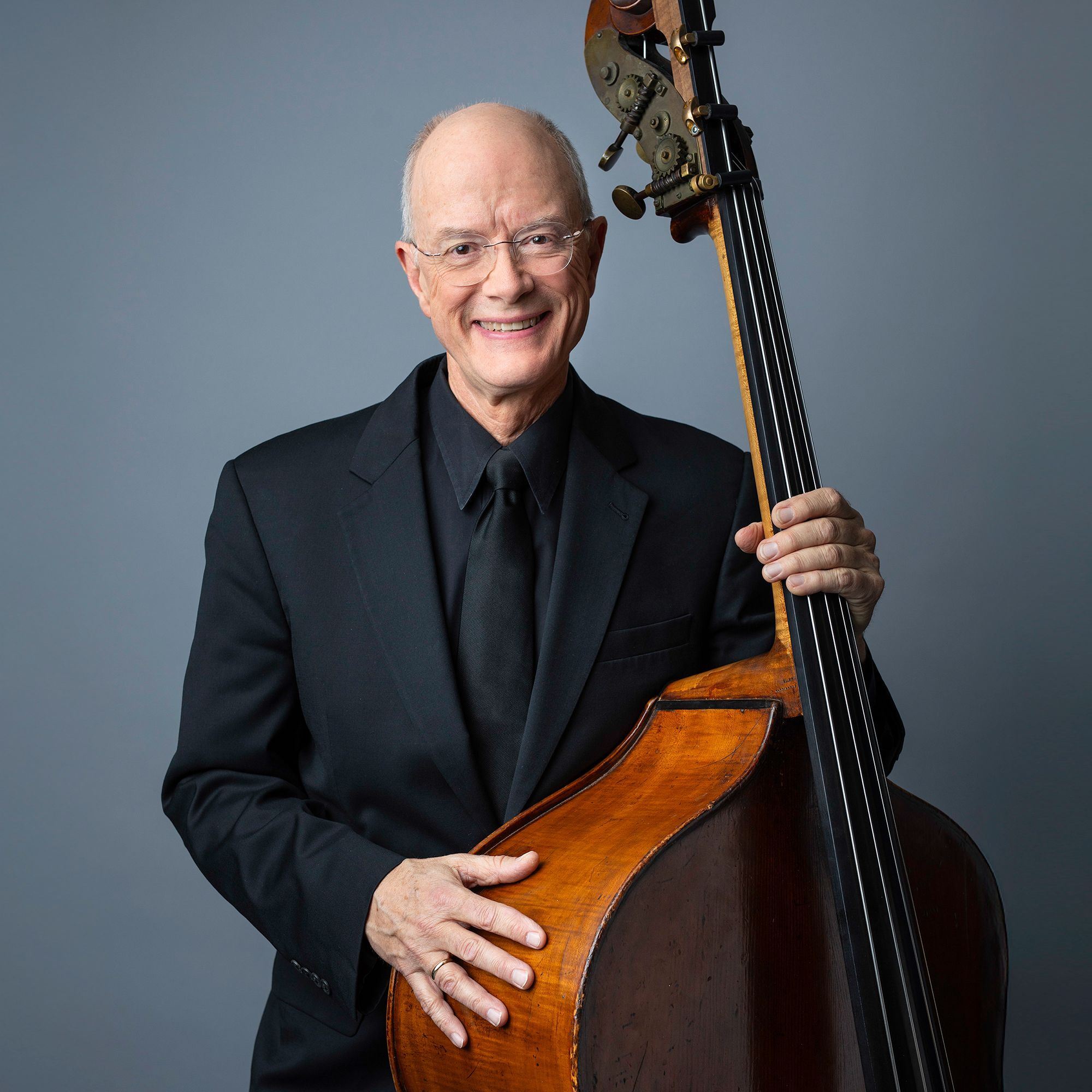 Edwin Barker headshot with bass