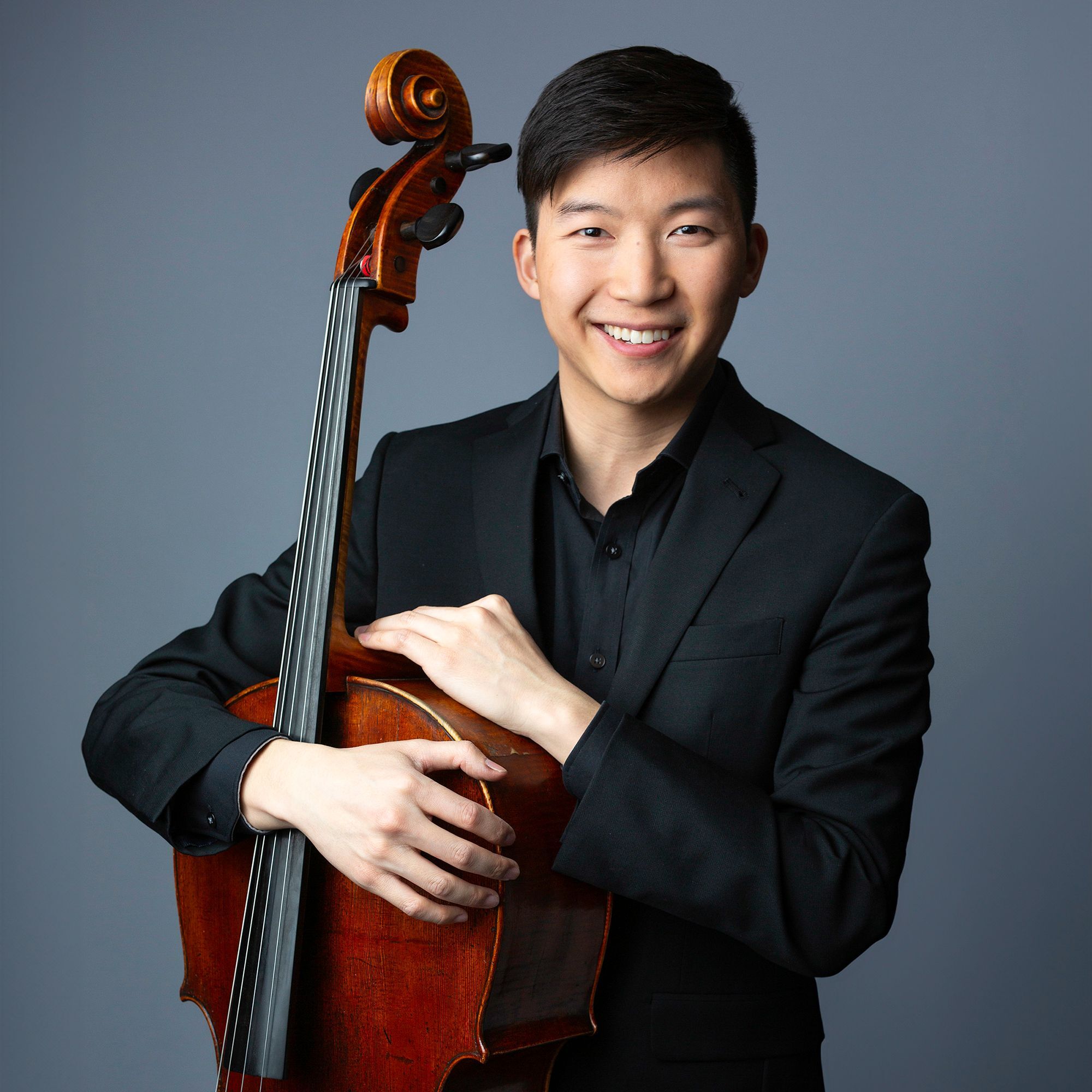 Will Chow standing with cello
