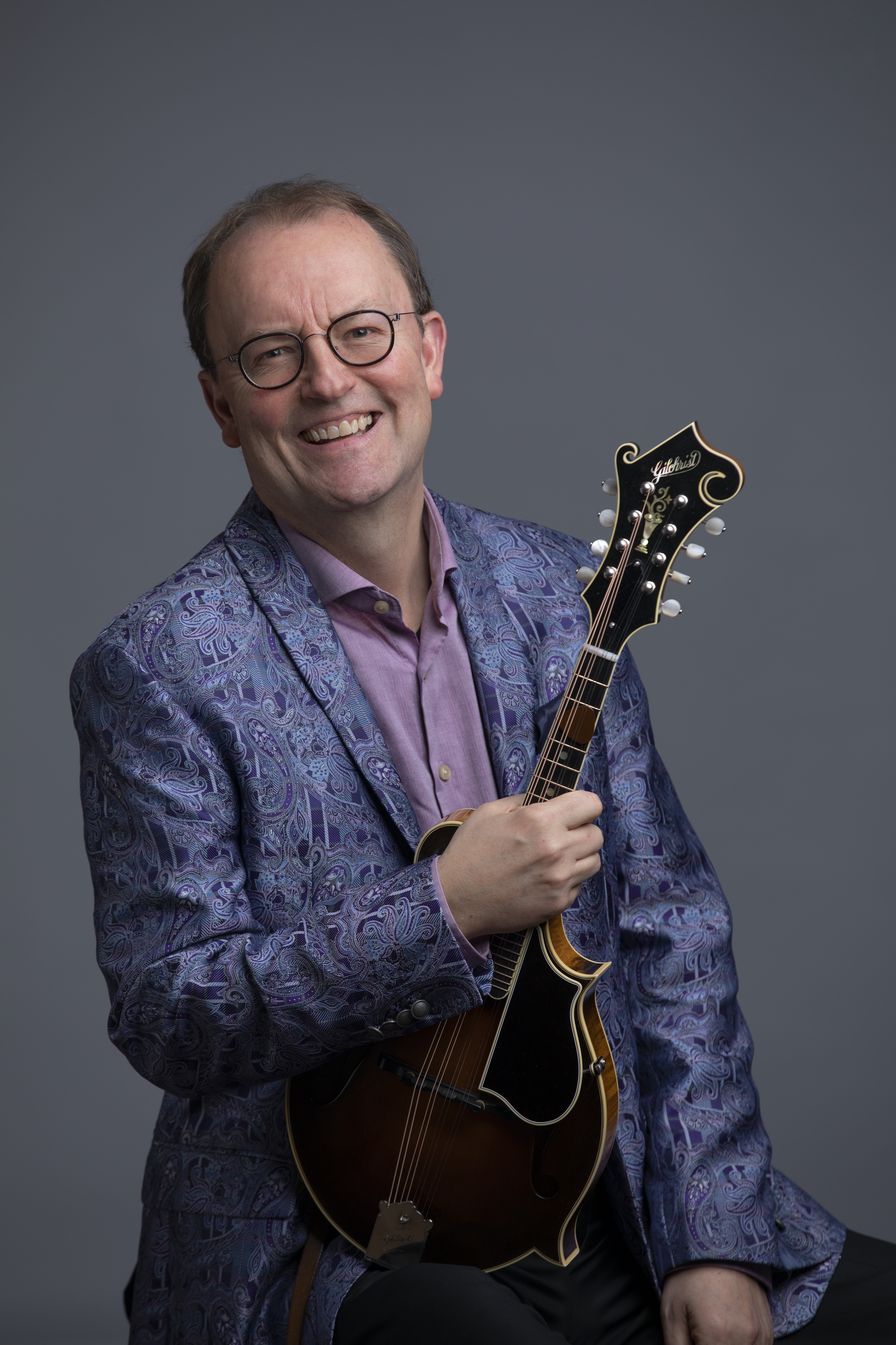 Jeff Midkiff holding his mandolin