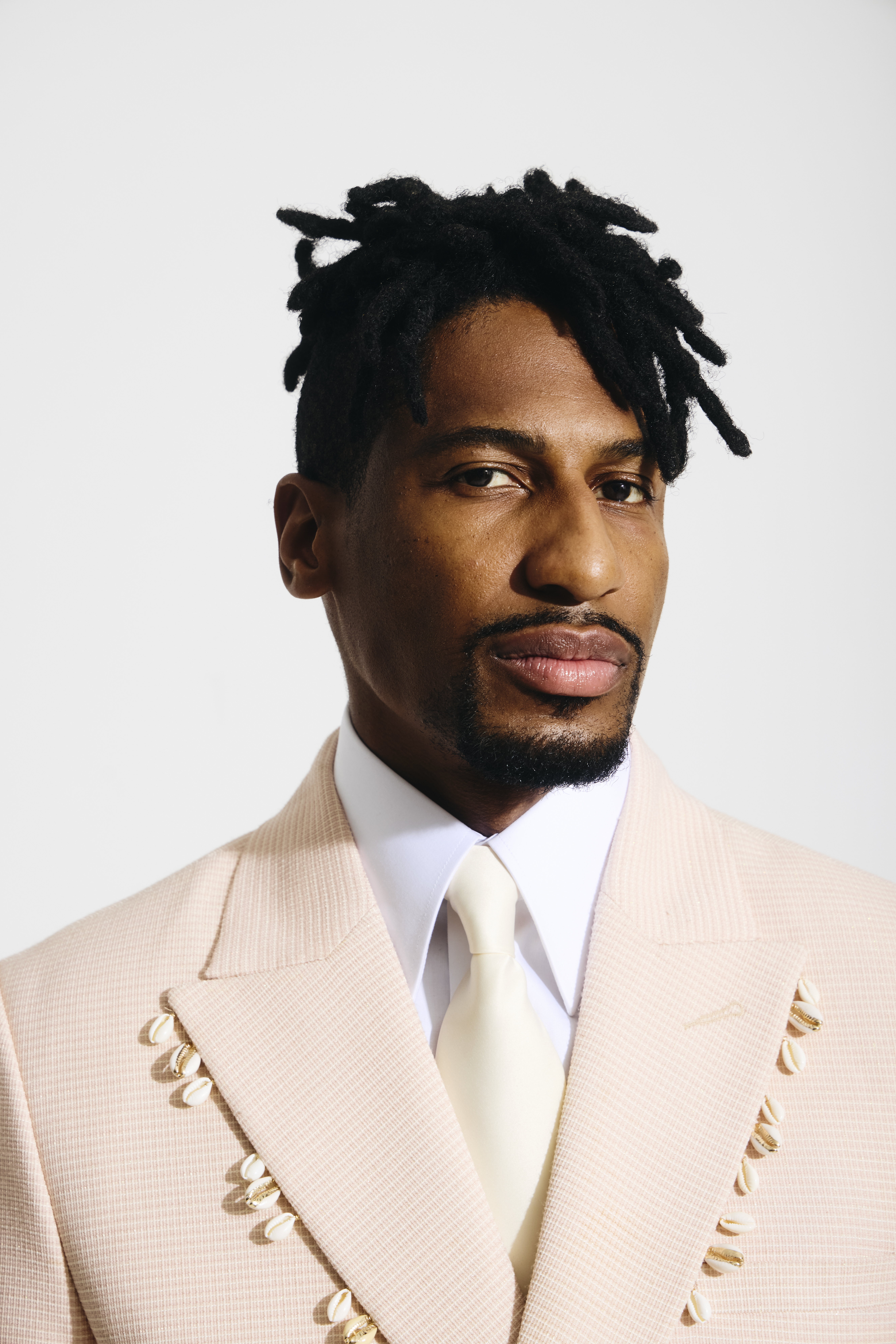 Jon Batiste with white suit
