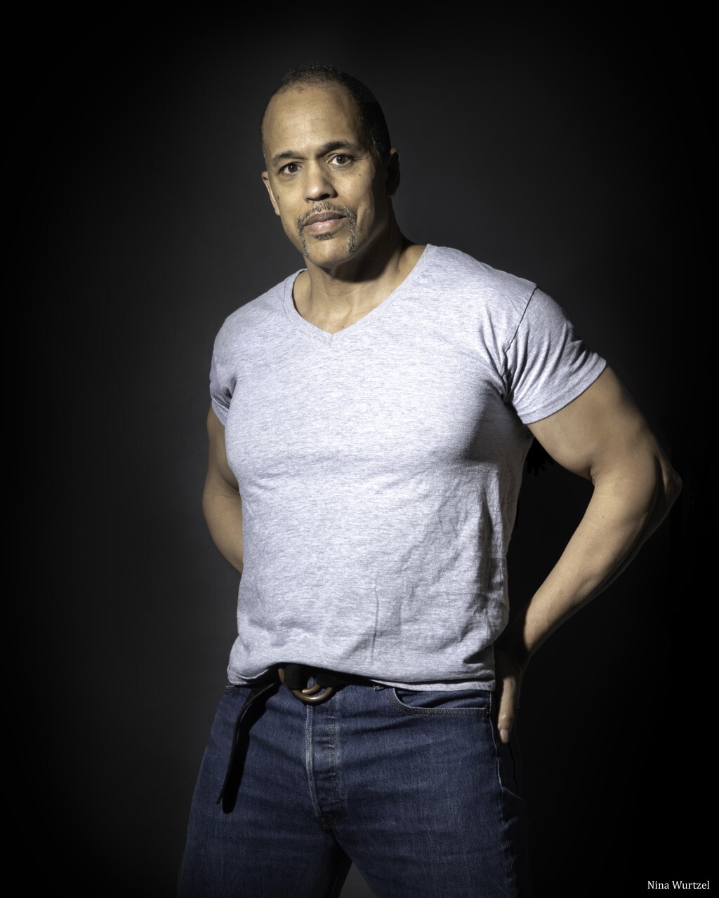 Keith Hamilton Cobb standing in front of a black background