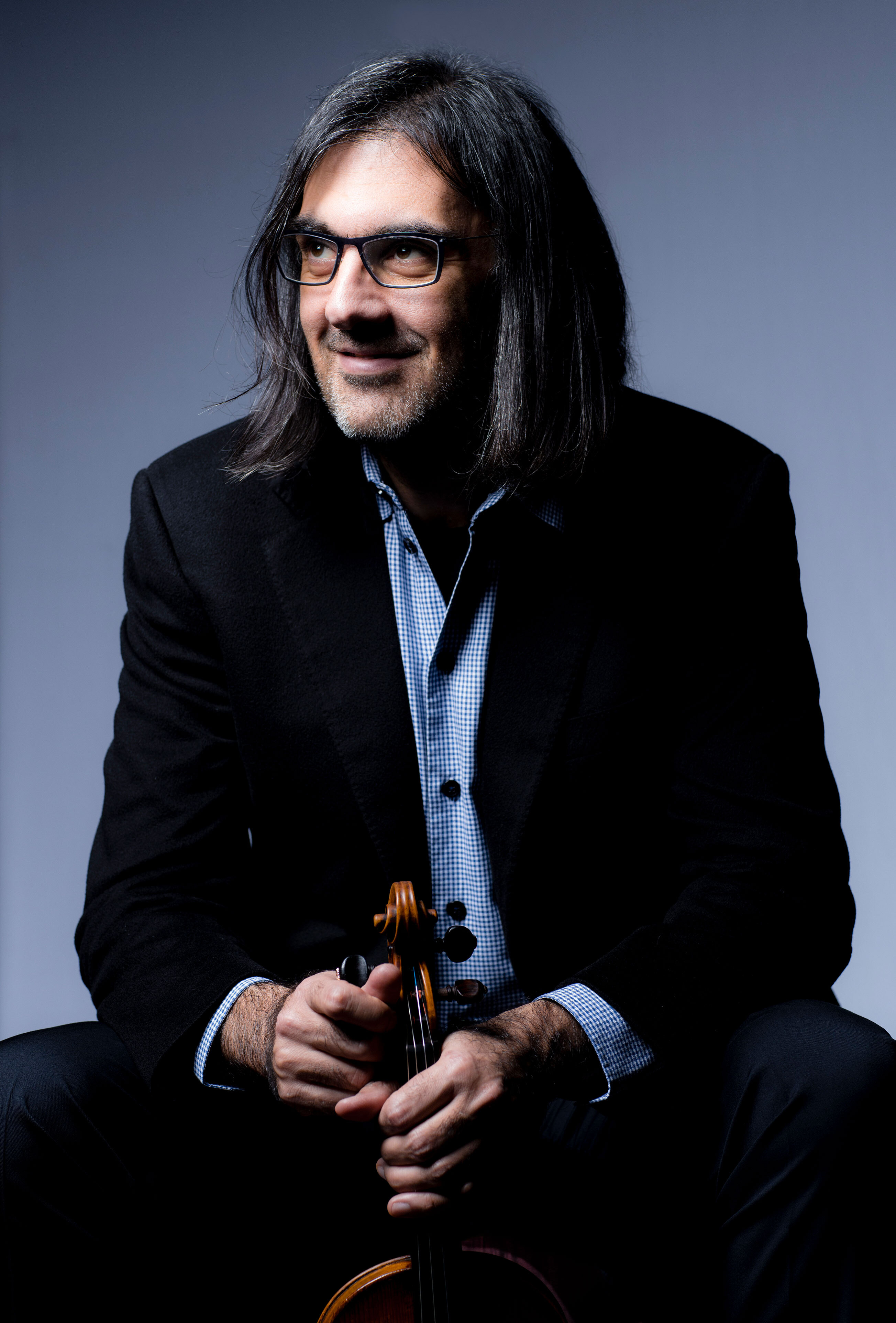 Leonidas Kavakos sitting and smiling
