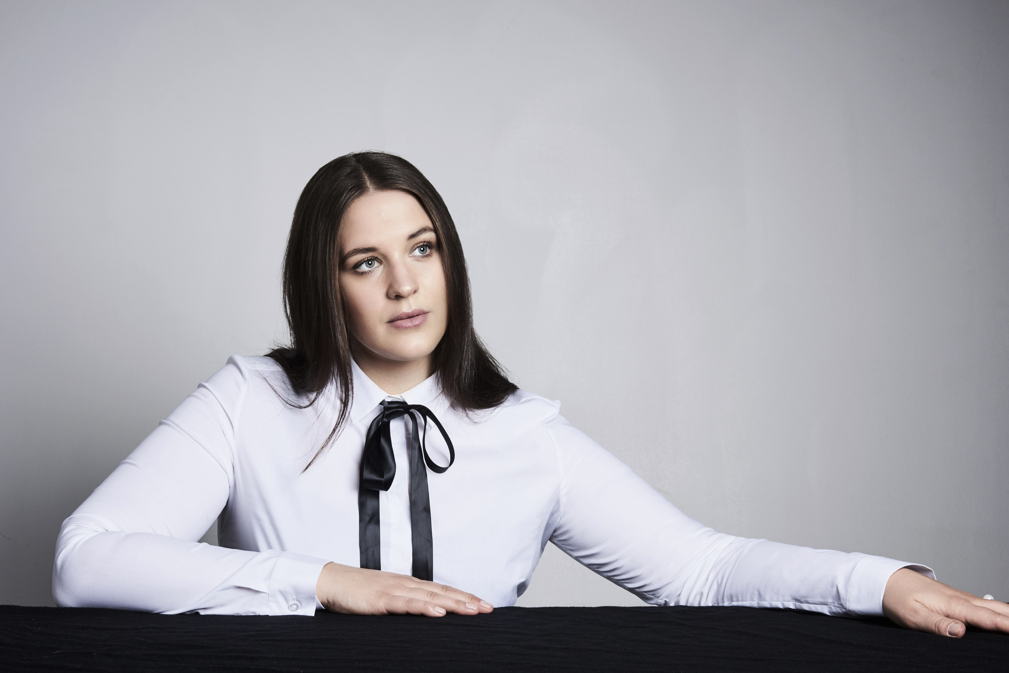 Lise Davidsen sitting down with her hands on a desk