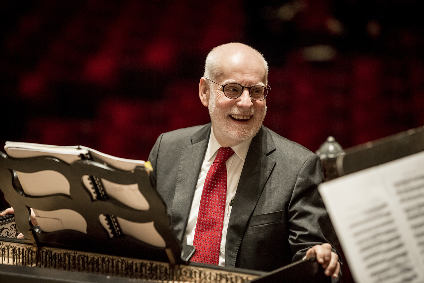 Ton Koopman smiling while conducting