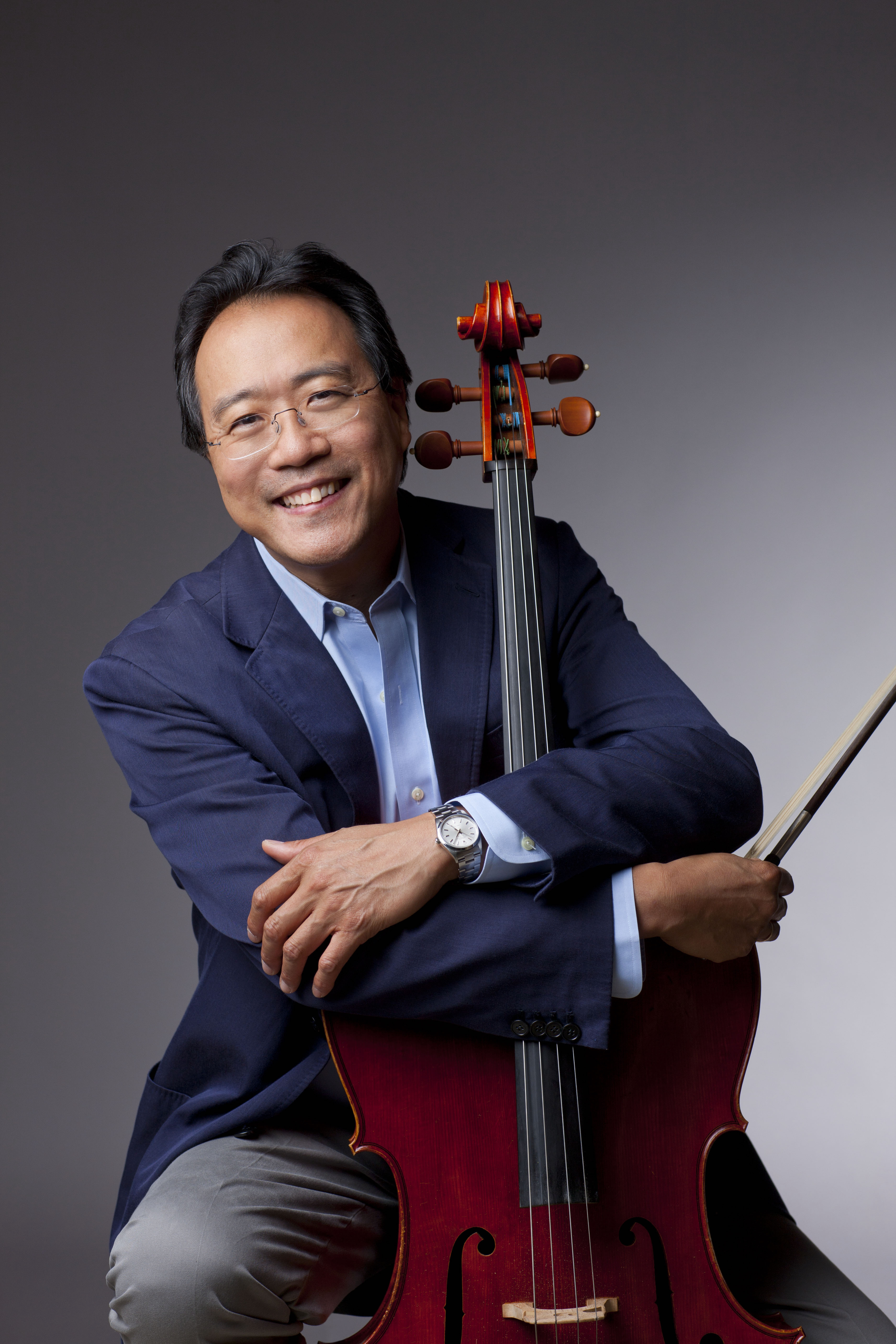Yo-Yo Ma headshot holding his cello and bow
