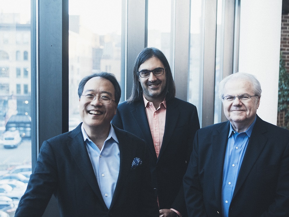 Yo-Yo Ma, Leonidas Kavakos and Emanuel Ax smiling and standing in front of a sunny window