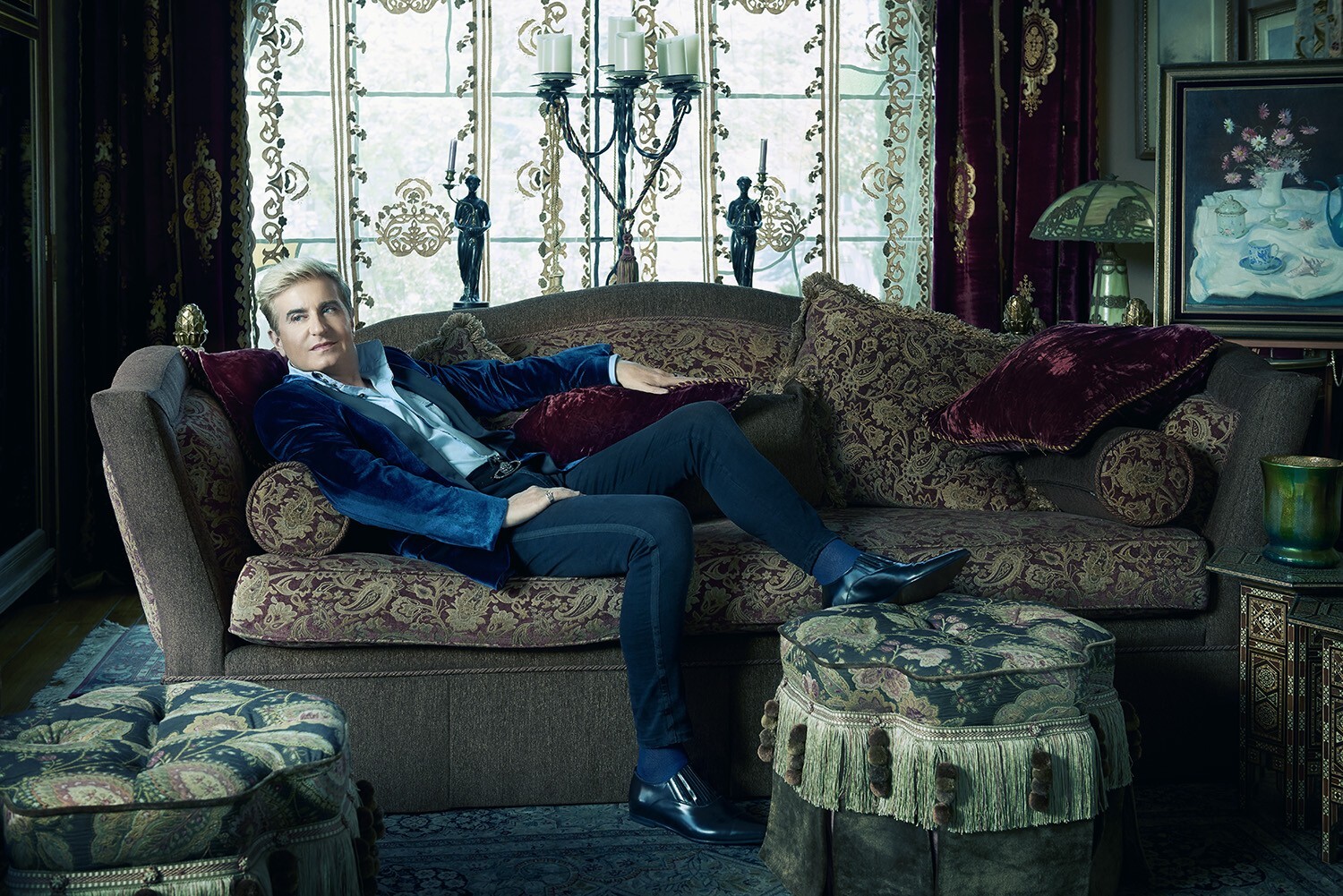 Jean-Yves Thibaudet lounging on an ornate couch