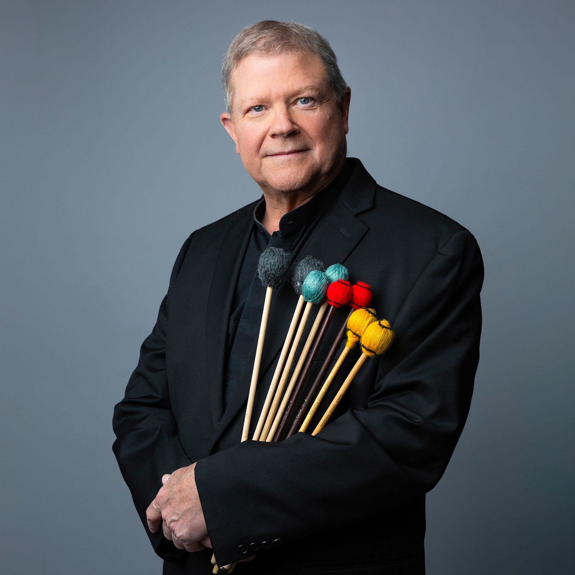 J. William Hudgins headshot holding percussion mallets