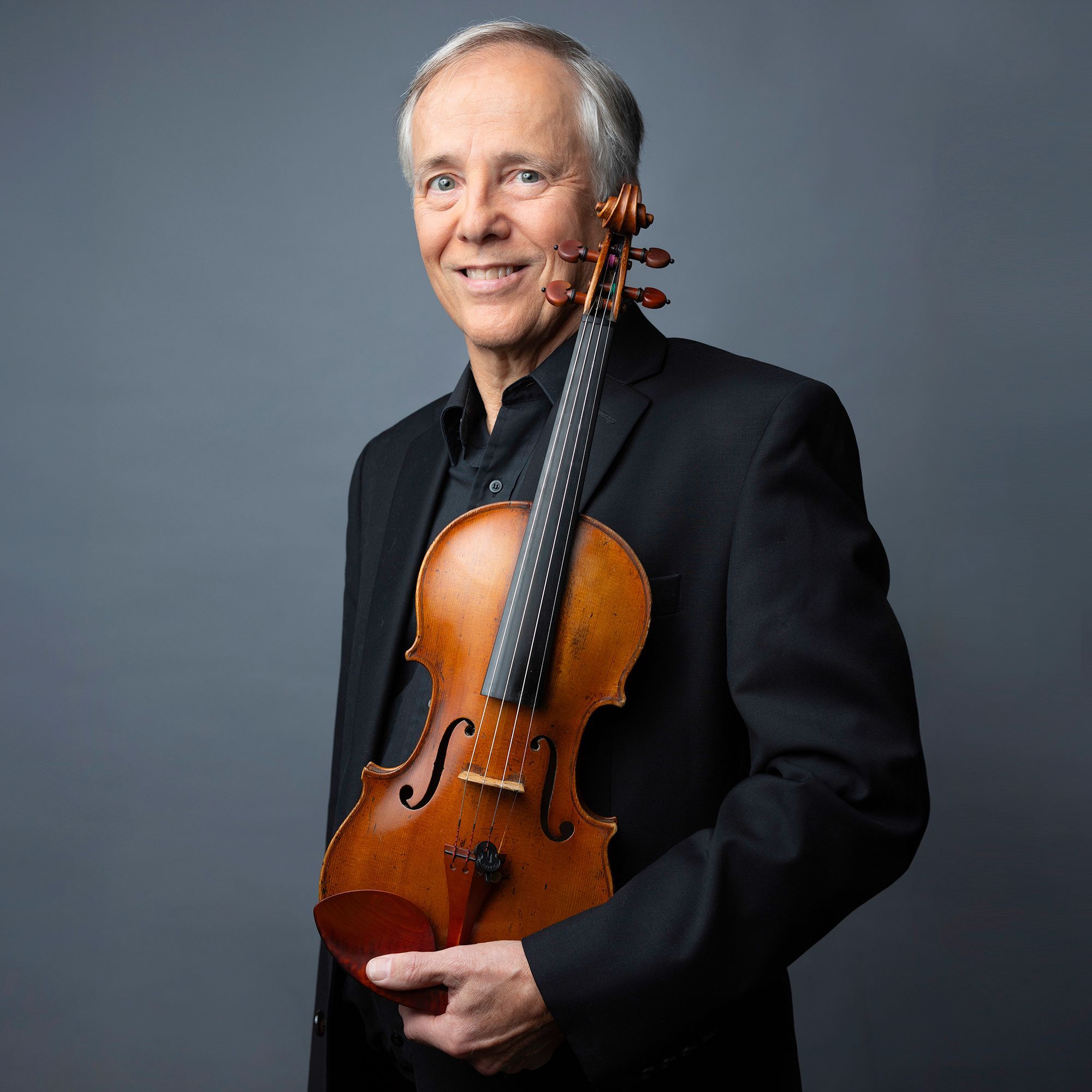 James Cooke headshot with violin