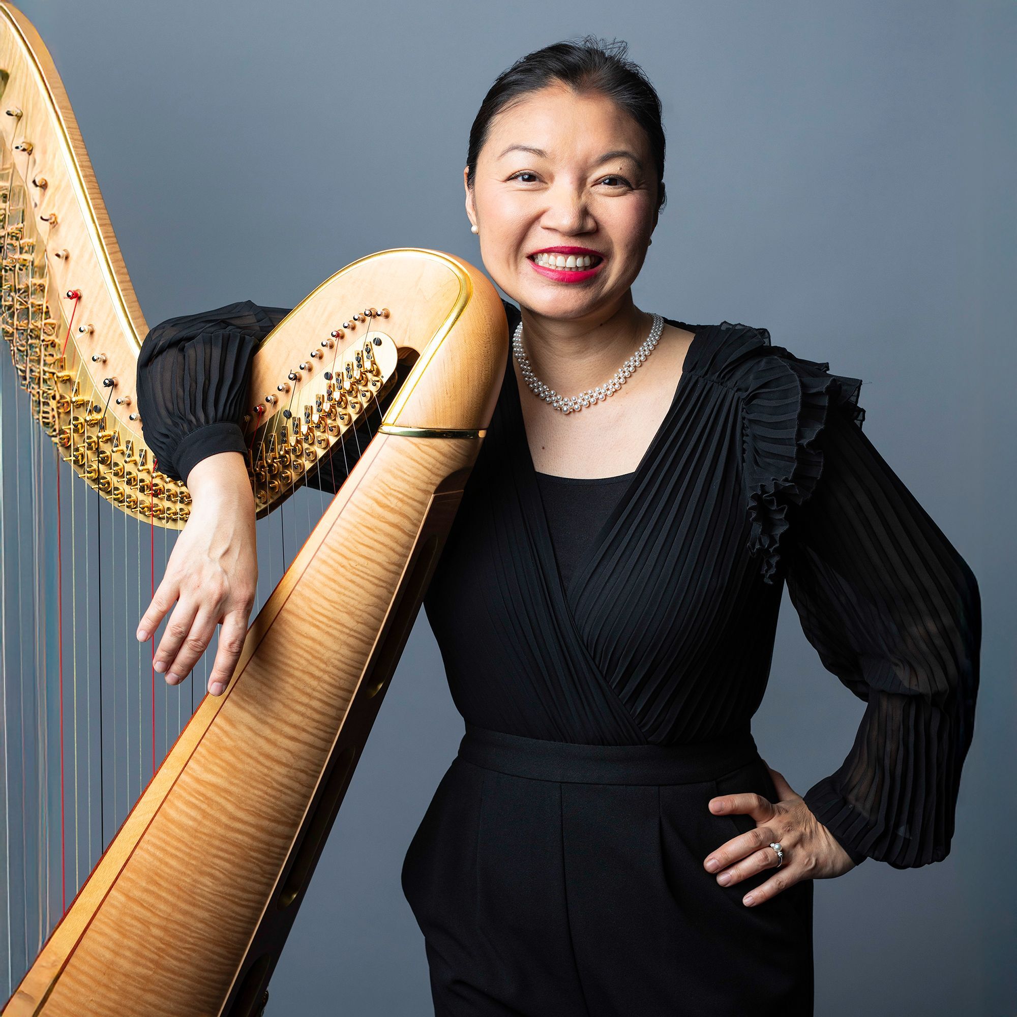 Jessica Zhou headshot with harp