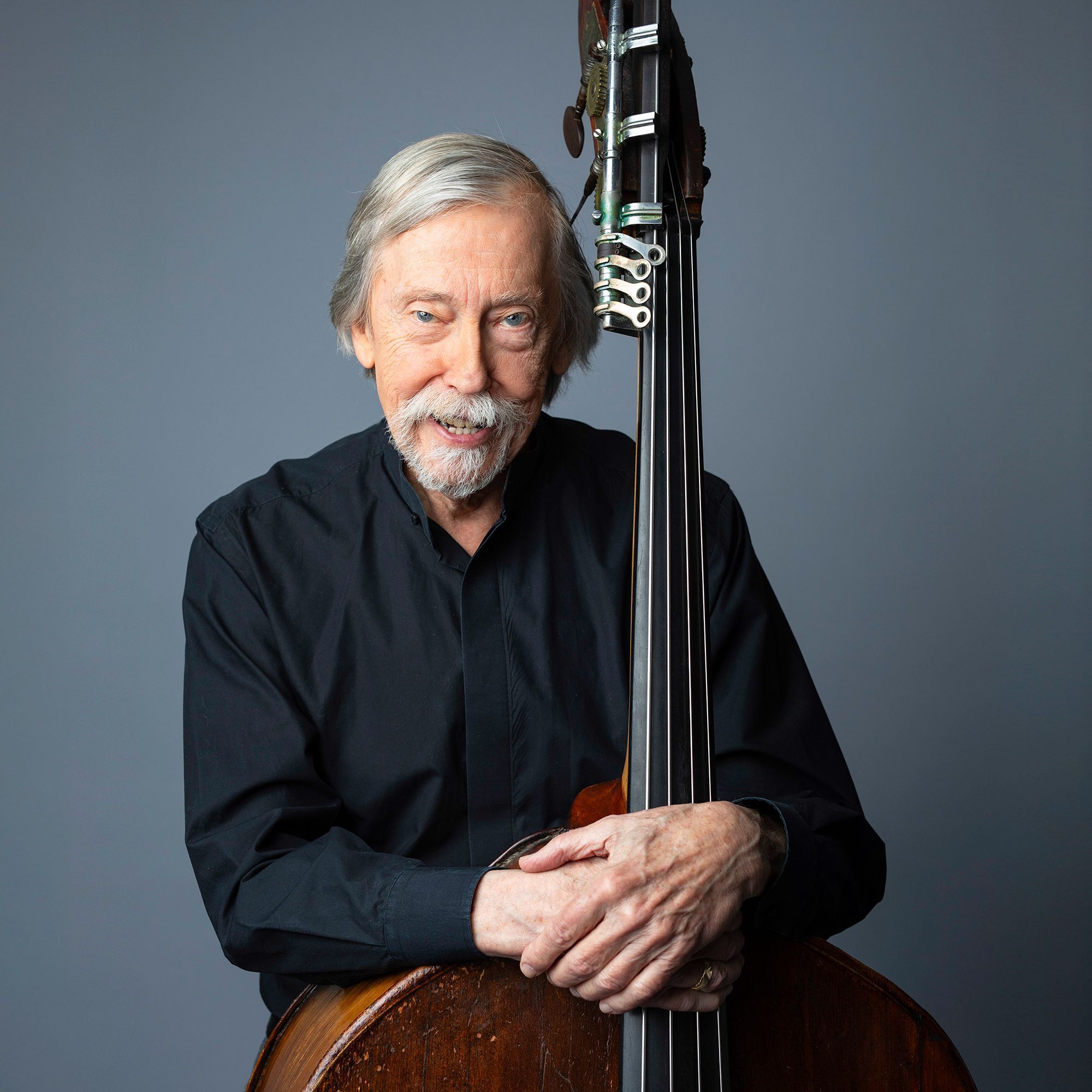 Joseph Hearne headshot with bass