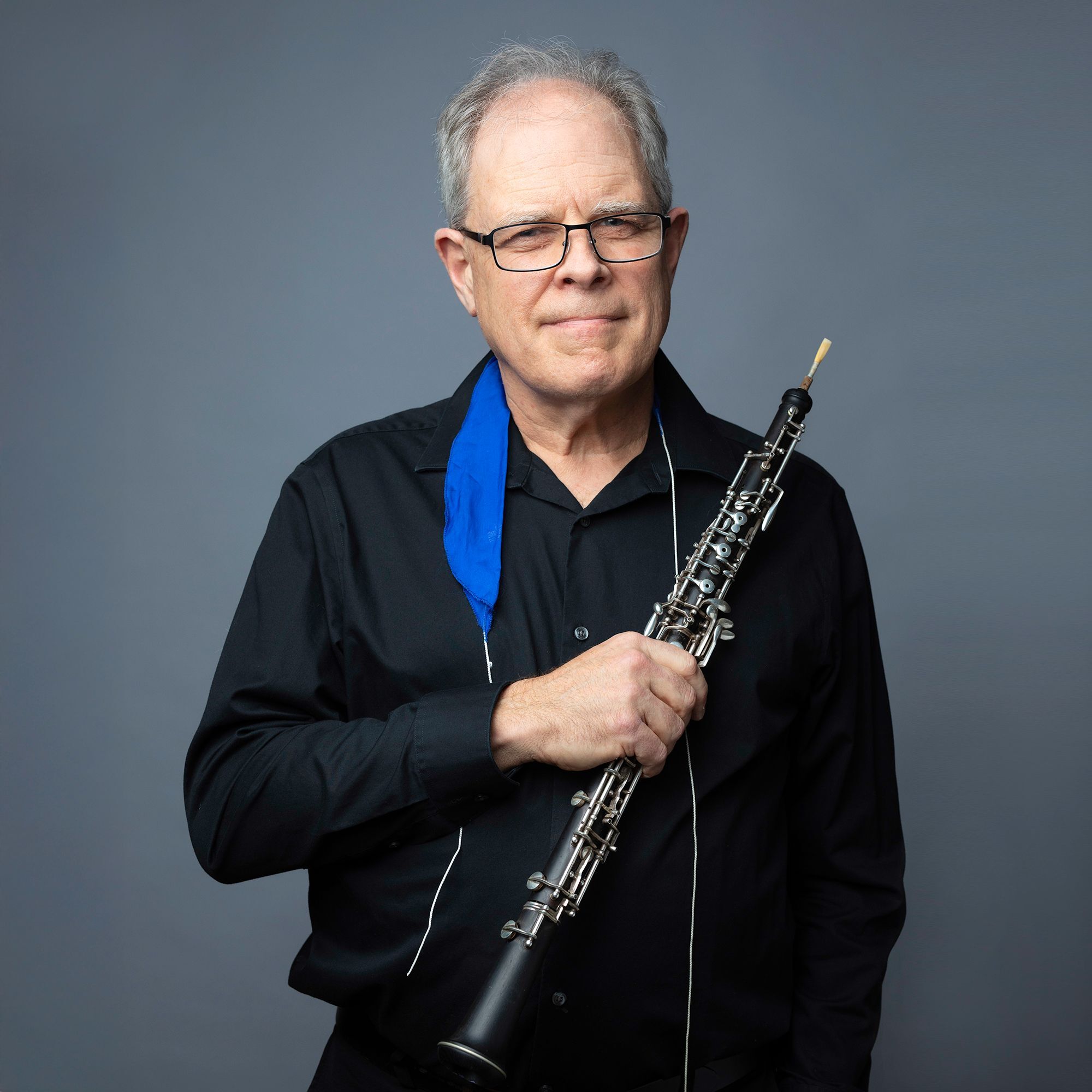 John Ferrillo headshot with oboe