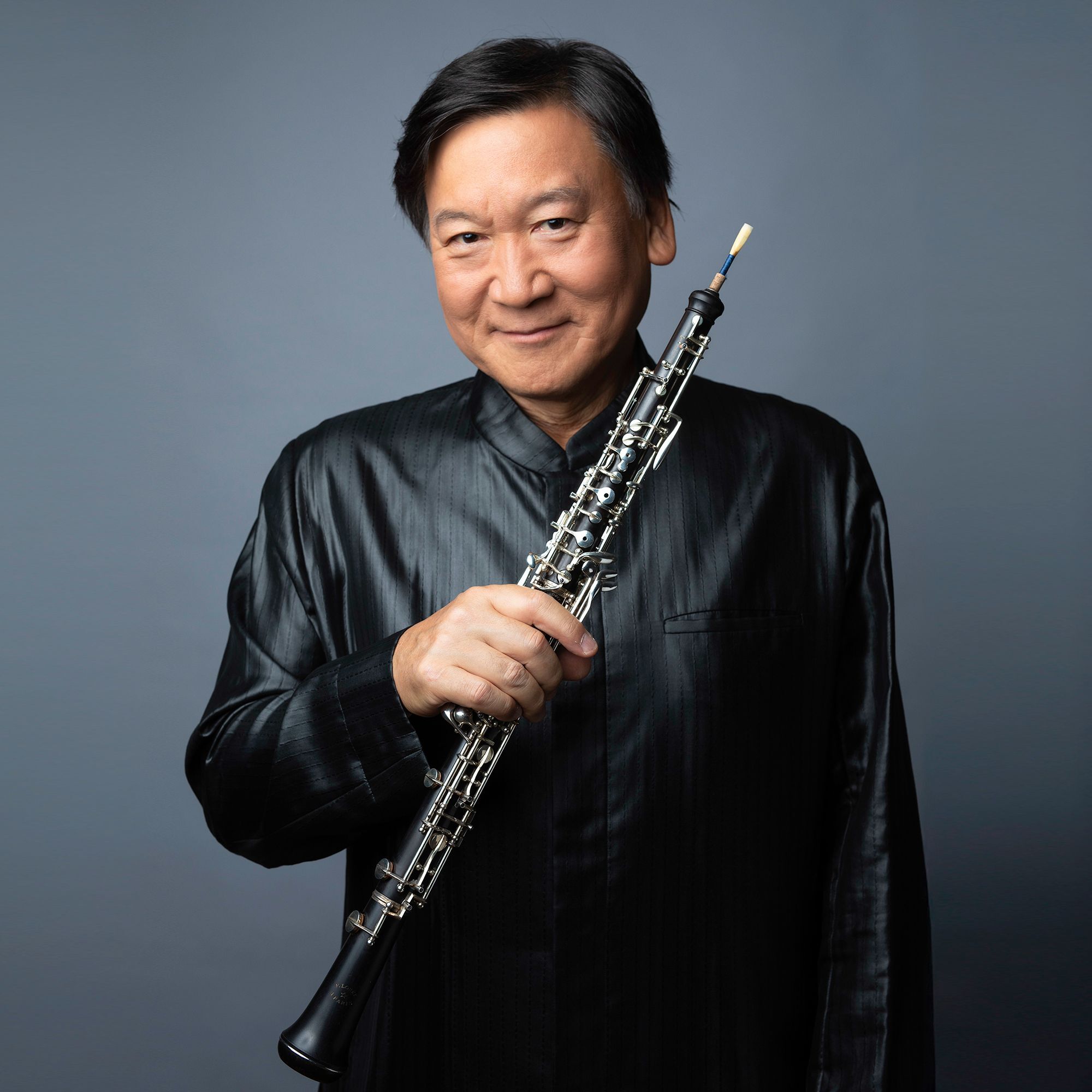 Keisuke Wakao headshot with oboe