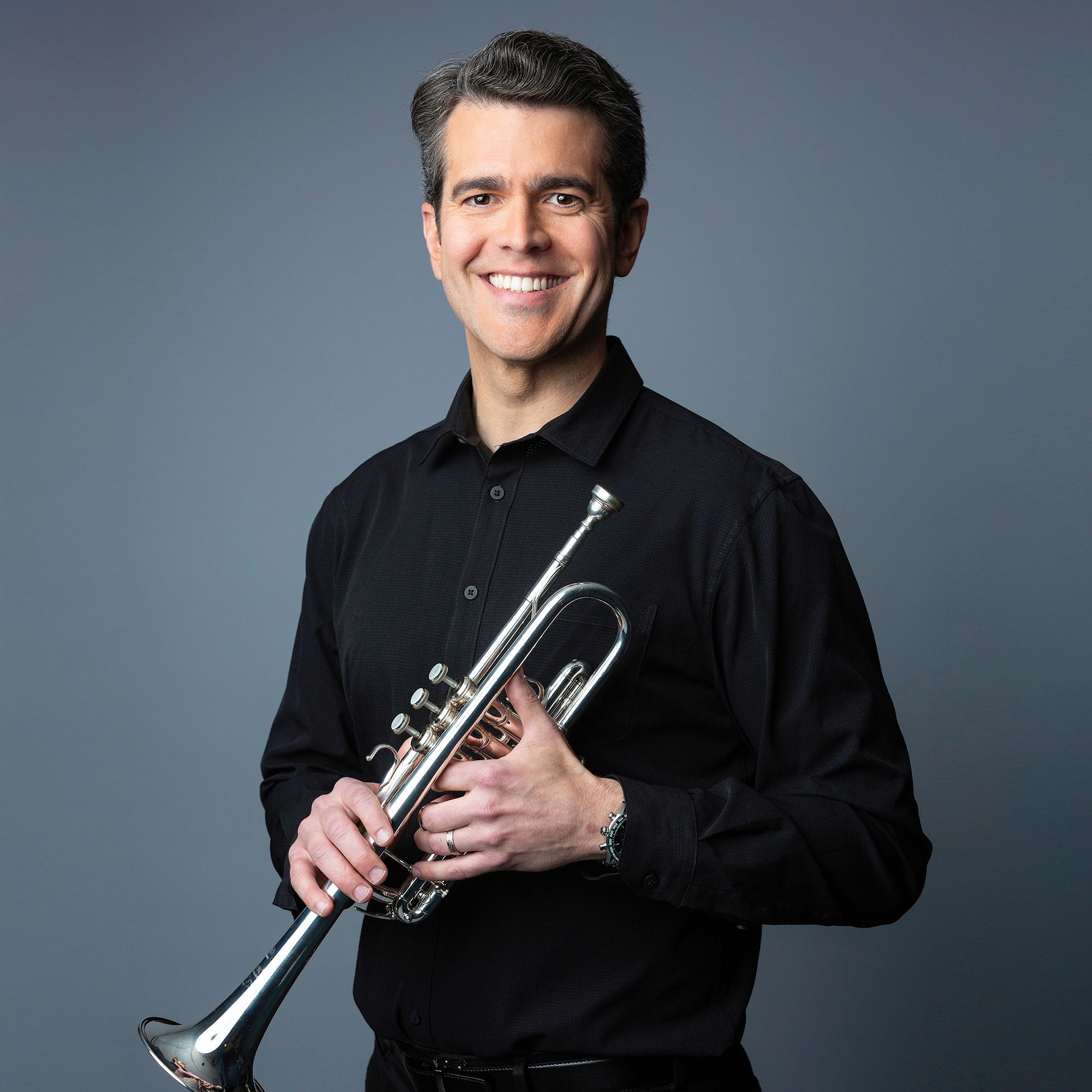 Michael Martin headshot with trumpet
