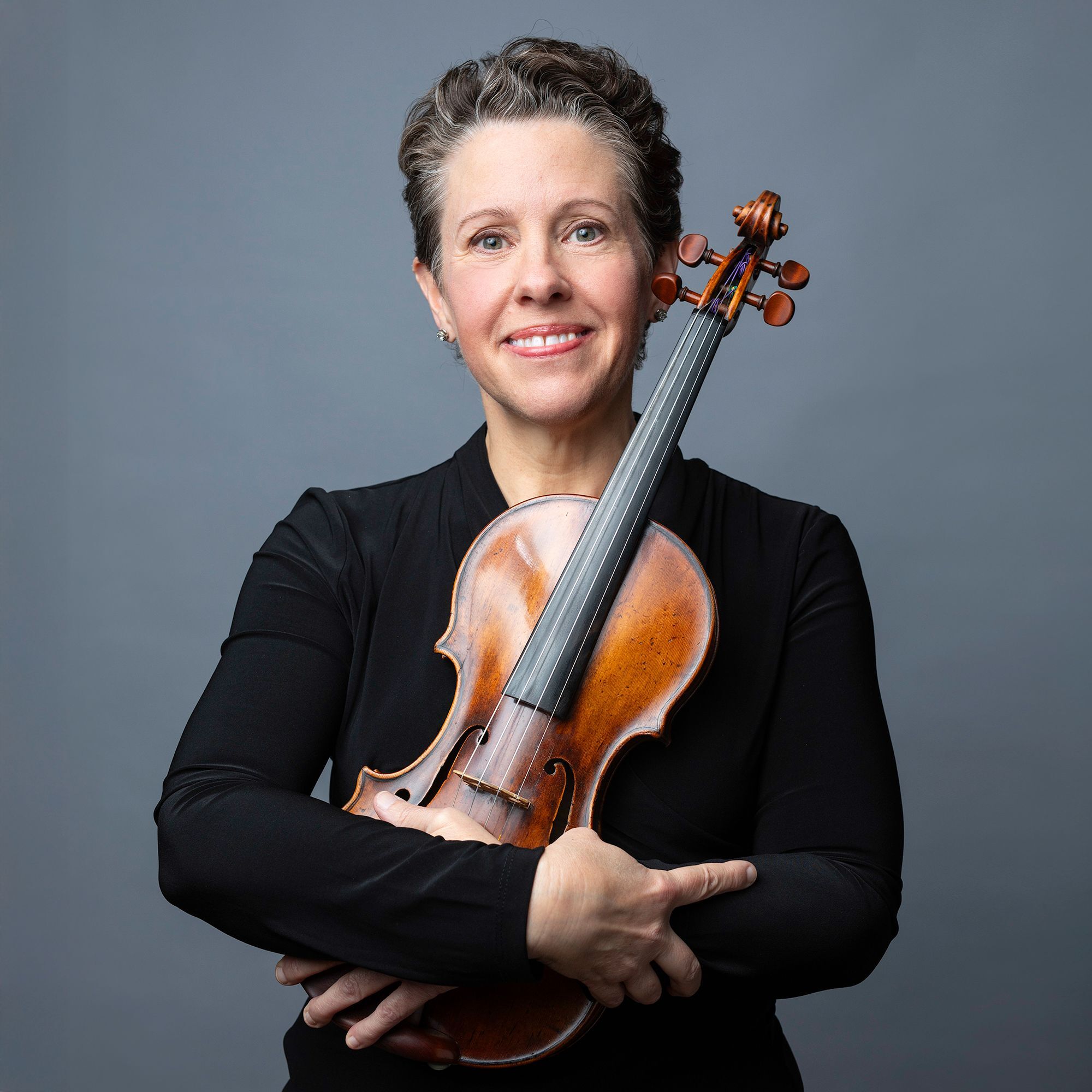 Nicole Monahan headshot with violin