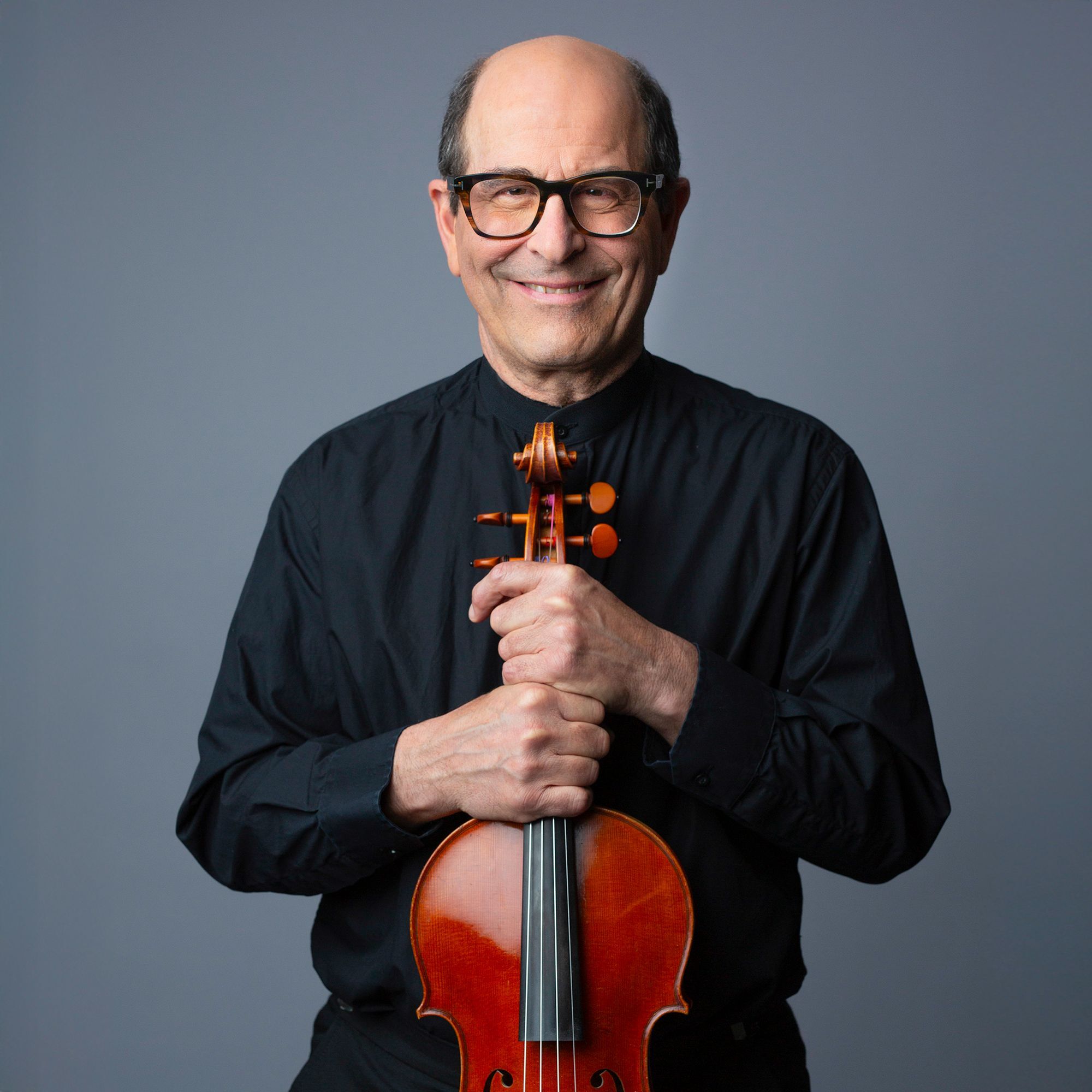 Steven Ansell headshot with viola