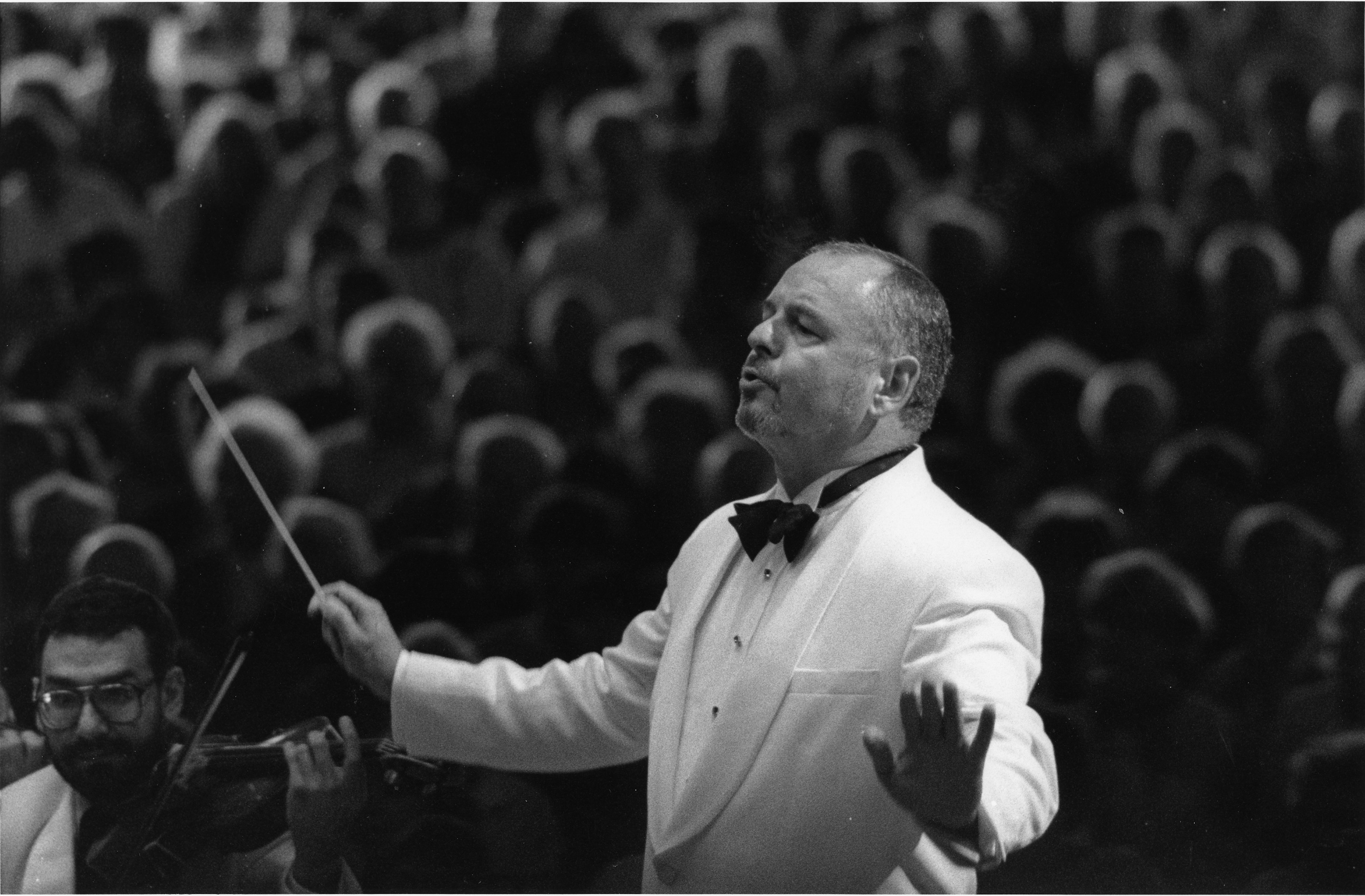 John Oliver conducting with baton at Tanglwood