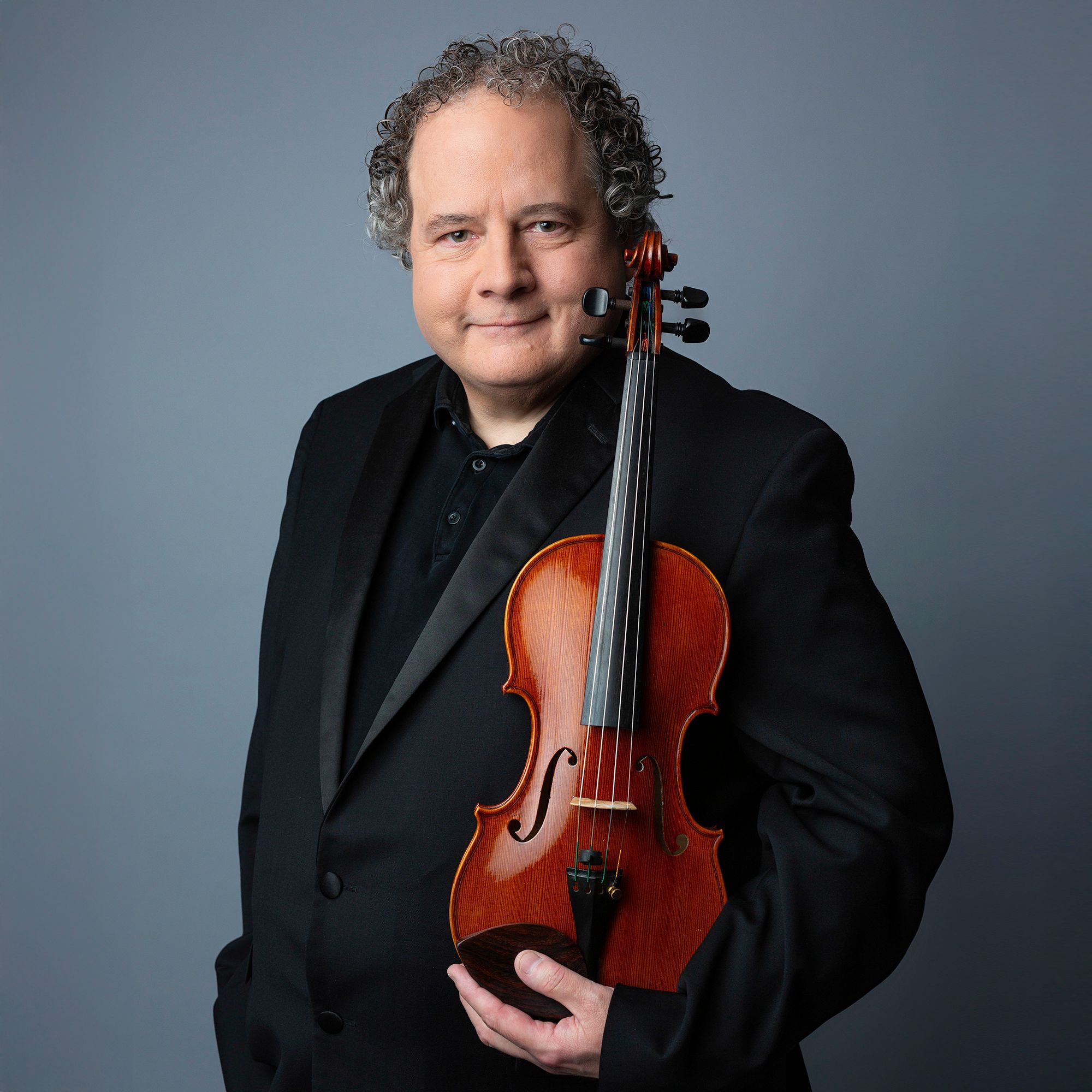 Victor Romanul headshot with violin
