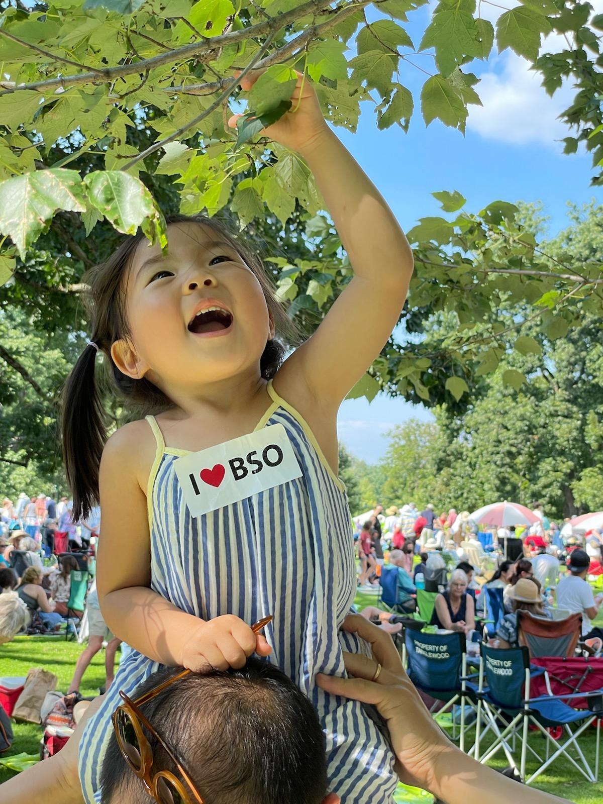 Smiling Child at Tanglewood with I Love BSO sticker