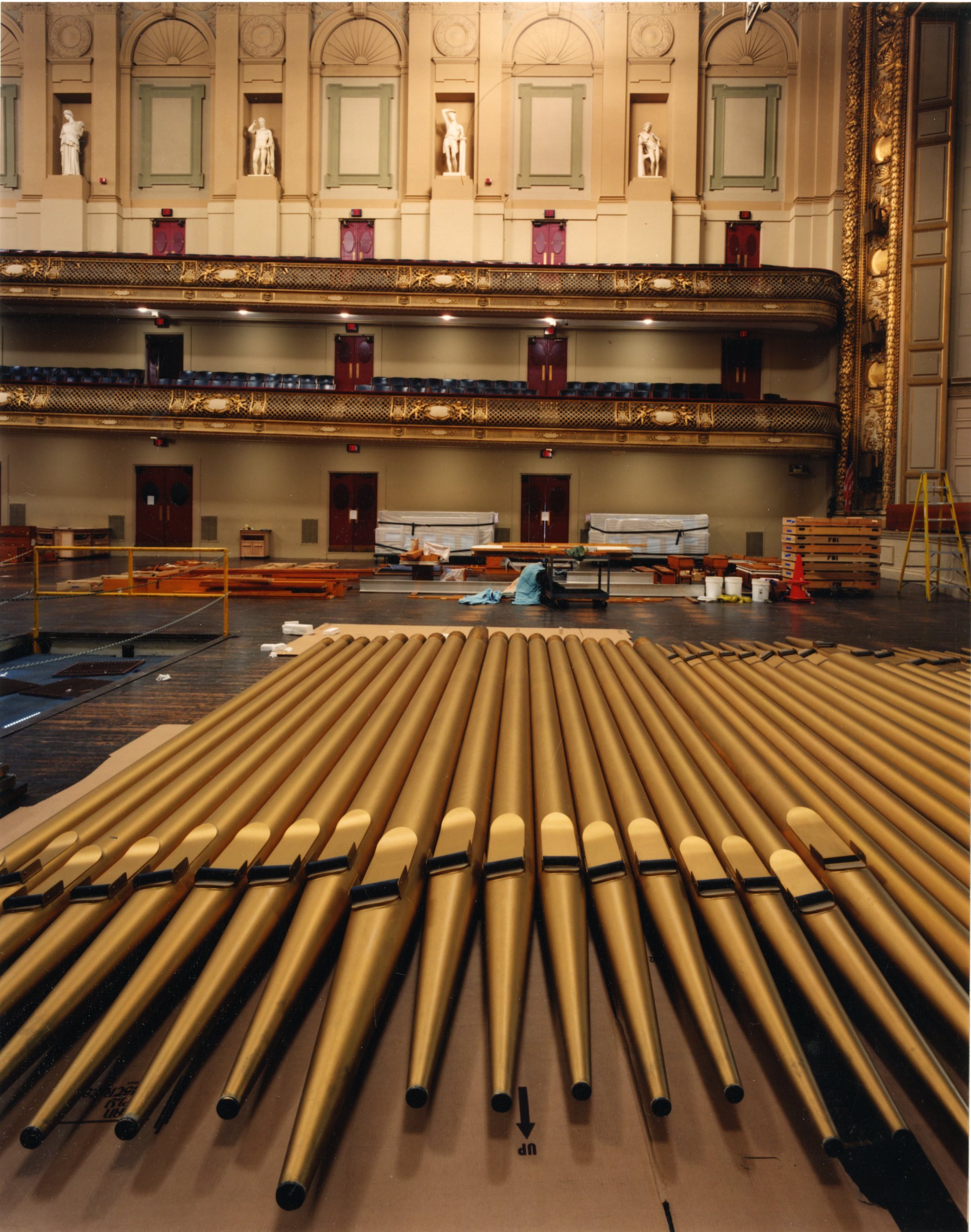 Organ pipes laid out on the floor of Symphony Hall