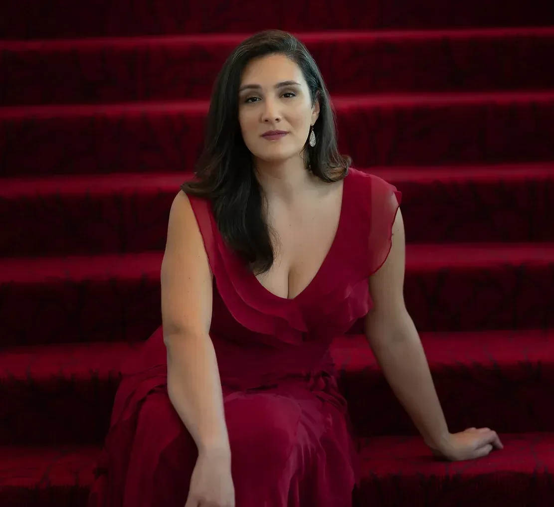 Ashely Dixon sitting on red stairs