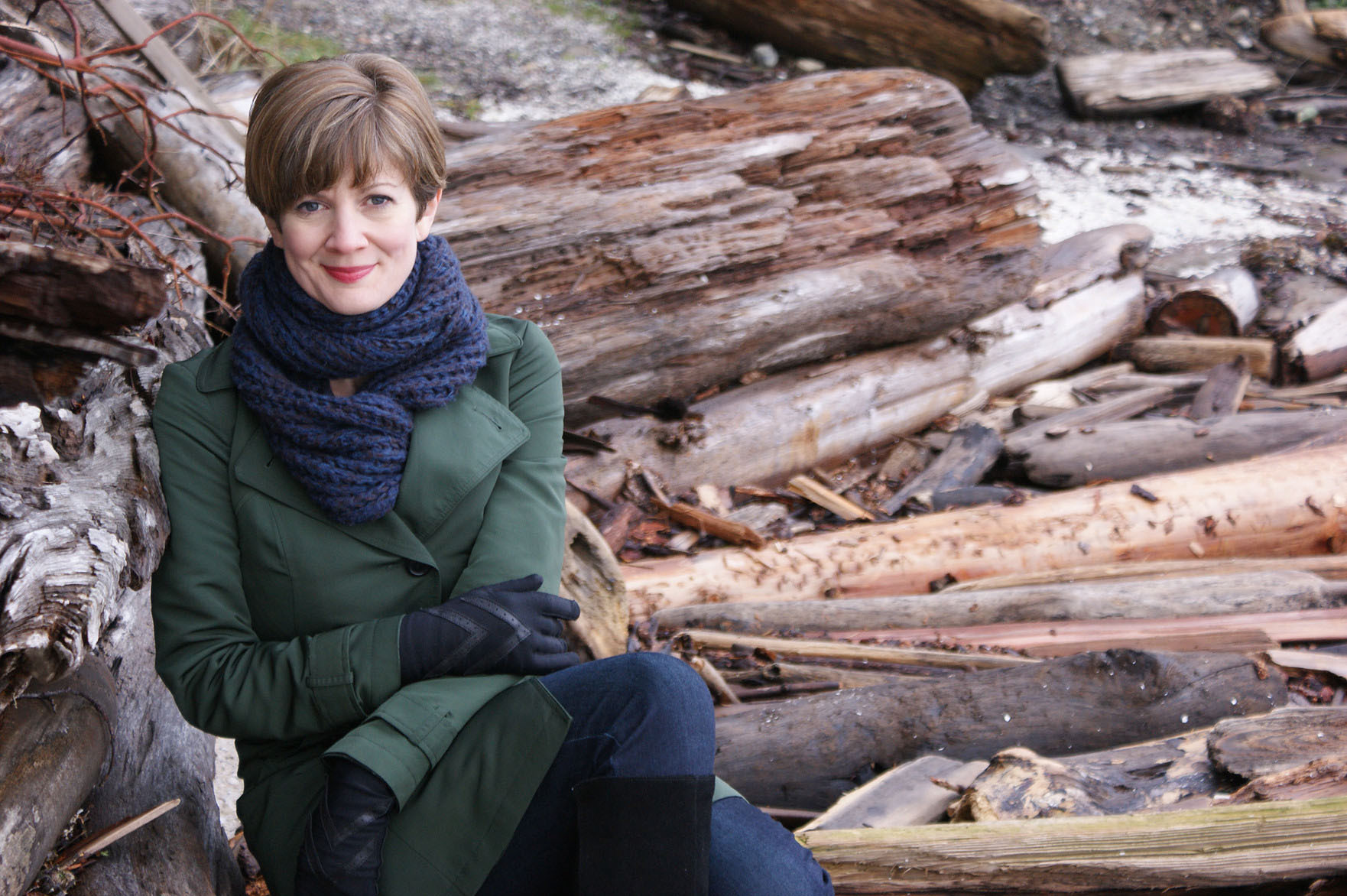 Susan Platts sitting outside, wearing winter clothes