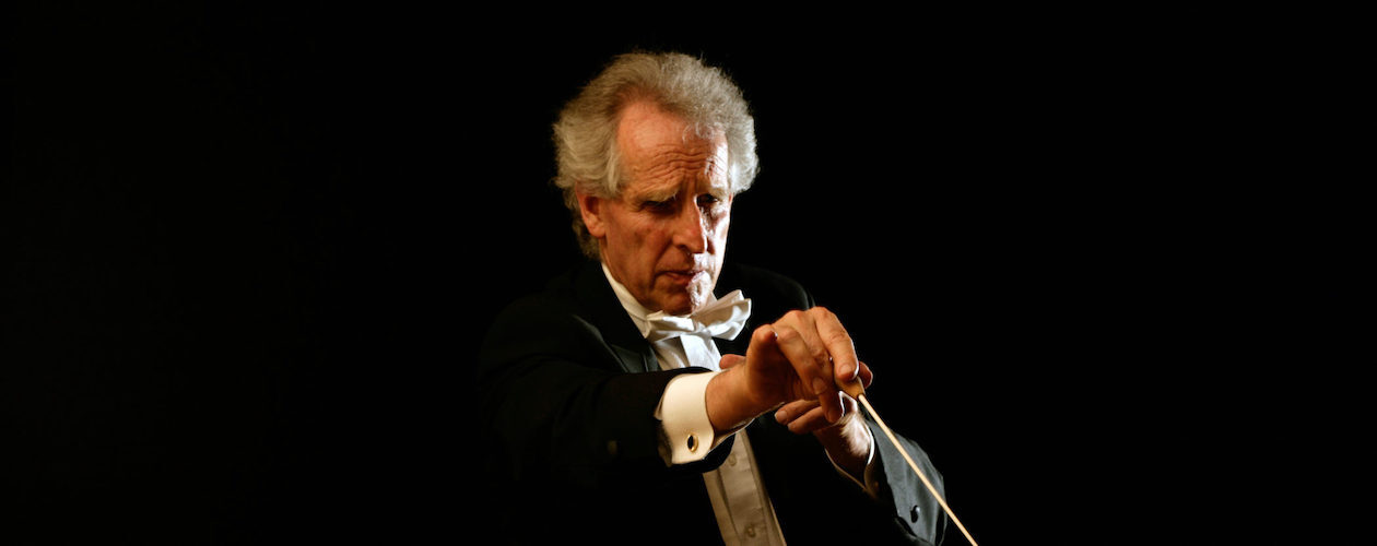 Ben Zander conducting with his  baton down