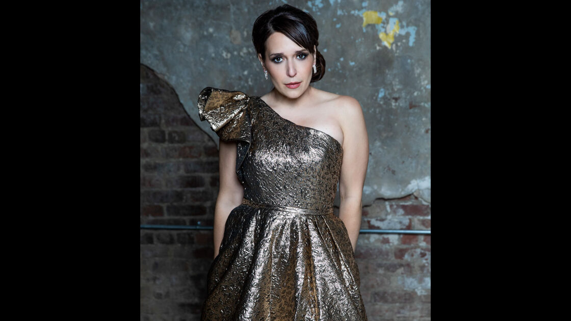 Jessica Vosk in a shiny gold dress