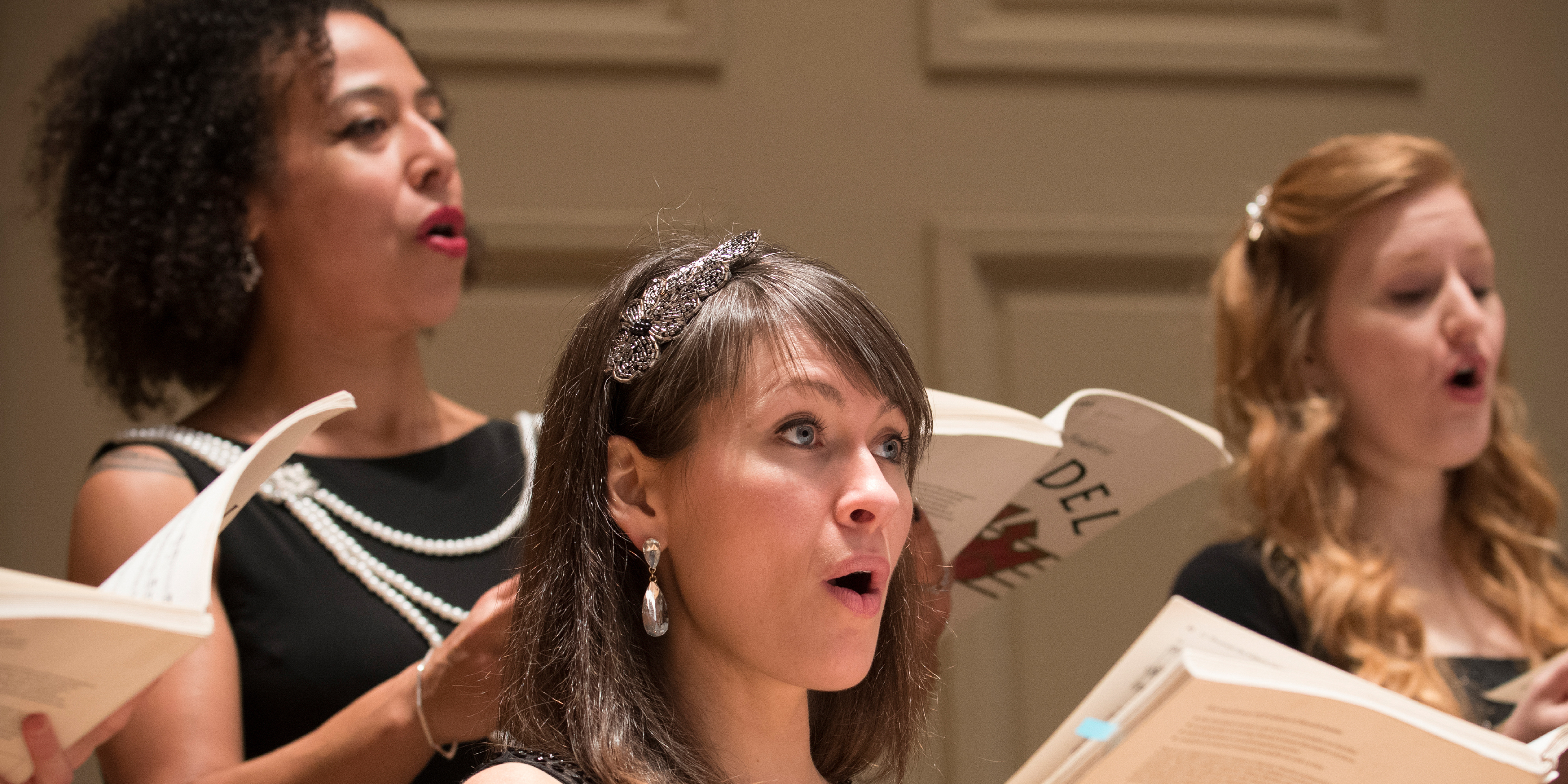 Women of the Handel and Haydn society singing on stage at Symphony Hall