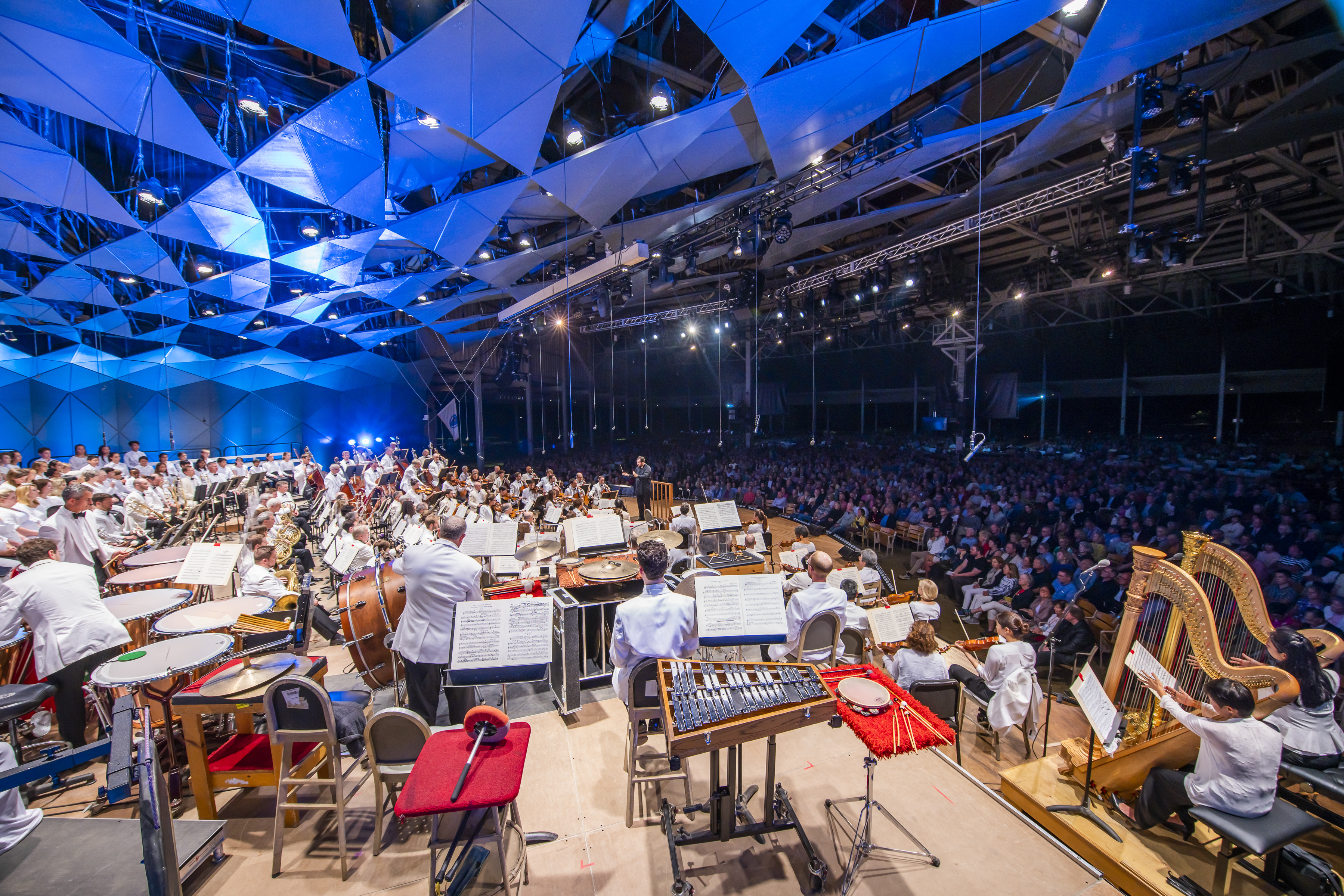 A wide shot showing the BSO performing to a full house in the Koussevitzky Music Shed