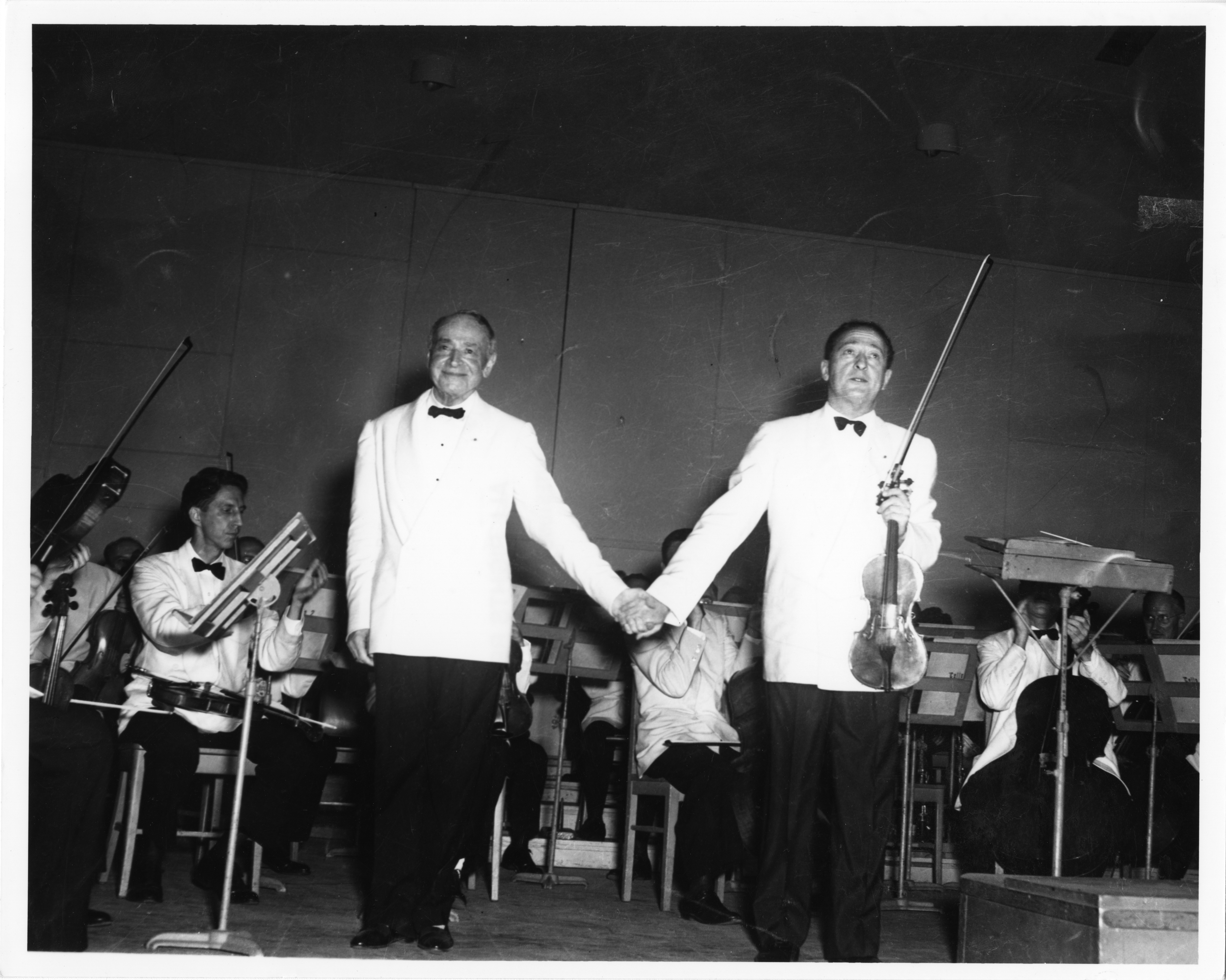 Serge Koussevitzky and violin virtuoso Jascha Heifetz acknowledge applause following Heifetz’ performance of the Tchaikovsky Violin Concerto at Tanglewood, August 4, 1949