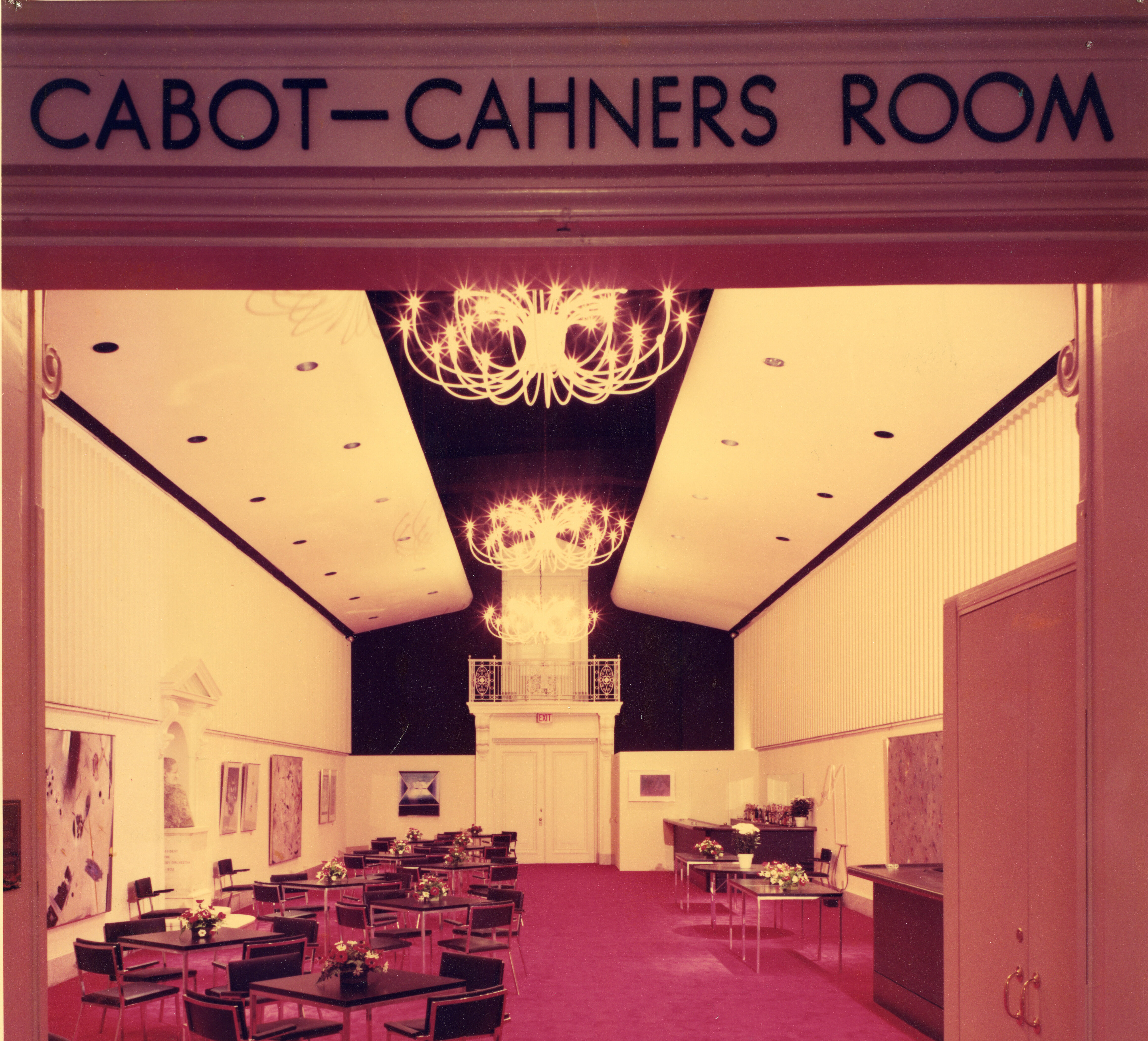 View of the Cabot-Cahners room, with red carpeting and tables and chairs