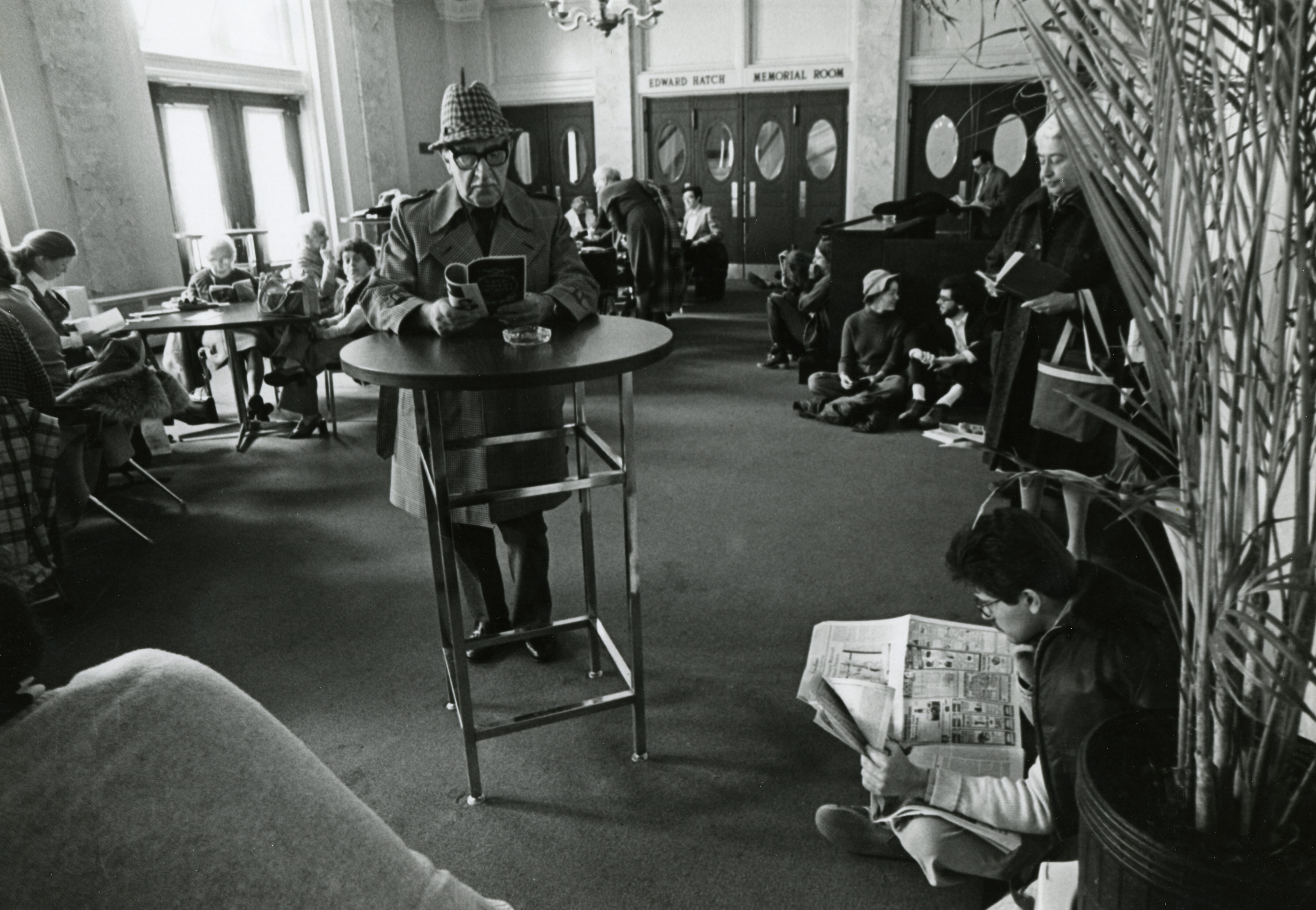 Audience members read and relax in the Edward Hatch Memorial Room at Symphony Hall